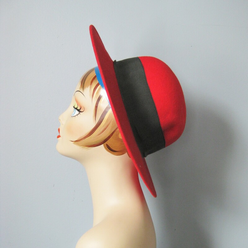 Fun 1980s vintage hat from Madcaps<br />
Round Crown wide brim in red wool felt with a wide black ribbon and tailored bow.<br />
Made in the USA<br />
Inner hat band measures 21.5in around<br />
<br />
Thanks for looking!<br />
#34388