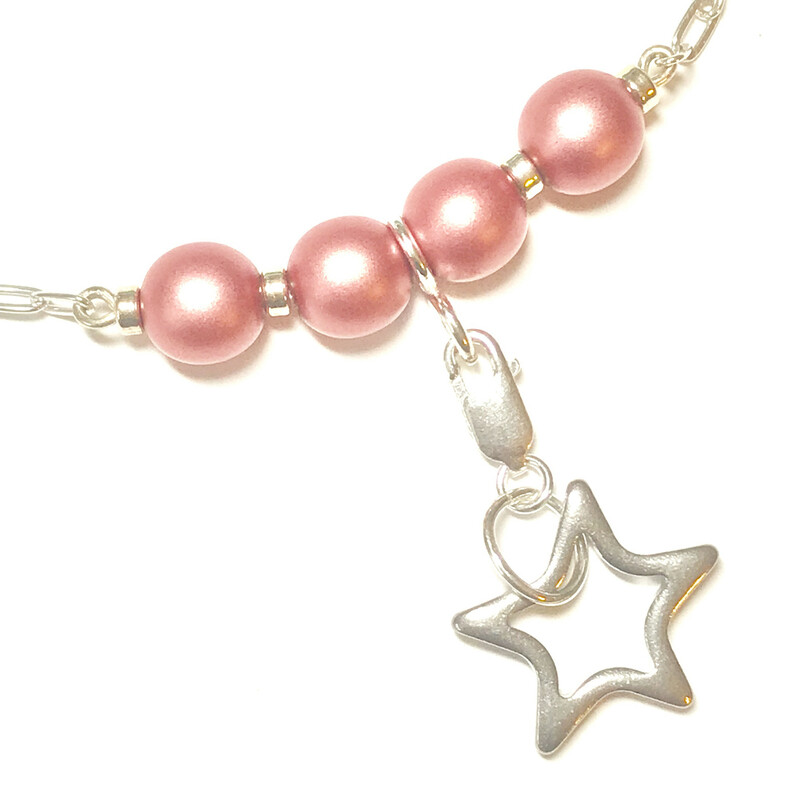 Karly Ne0016-pr 16, Powder R, Size: Necklace
Sterling Silver Accessories-8mm. Swarovski Pearls-Charms Sets: Depending on Selected Set could be  Sterling Silver or Silver Plated-Chain Length: 16