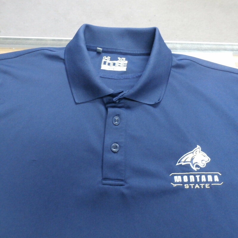Montana Bobcats Under Armour Men's Polo Size XL Blue Polyester #25356<br />
Rating: (see below) 3 - Good Condition<br />
Team: Montana Bobcats<br />
Player: N/A<br />
Brand: Under armour<br />
Size: Men's - XL(Measured: Across chest 25\", length 28\")<br />
Measured: Armpit to armpit; shoulder to hem<br />
Color: Blue<br />
Style: Polo shirt; embroidered shirt; heatgear; loose fit<br />
Material: 100% Polyester<br />
Condition: 3 - Good Condition - wrinkled; material looks and feels good; sangs throughout; armpits have sweat stains; other few small stains; signs of use; no rips or holes<br />
Item #:  25356<br />
Shipping: FREE