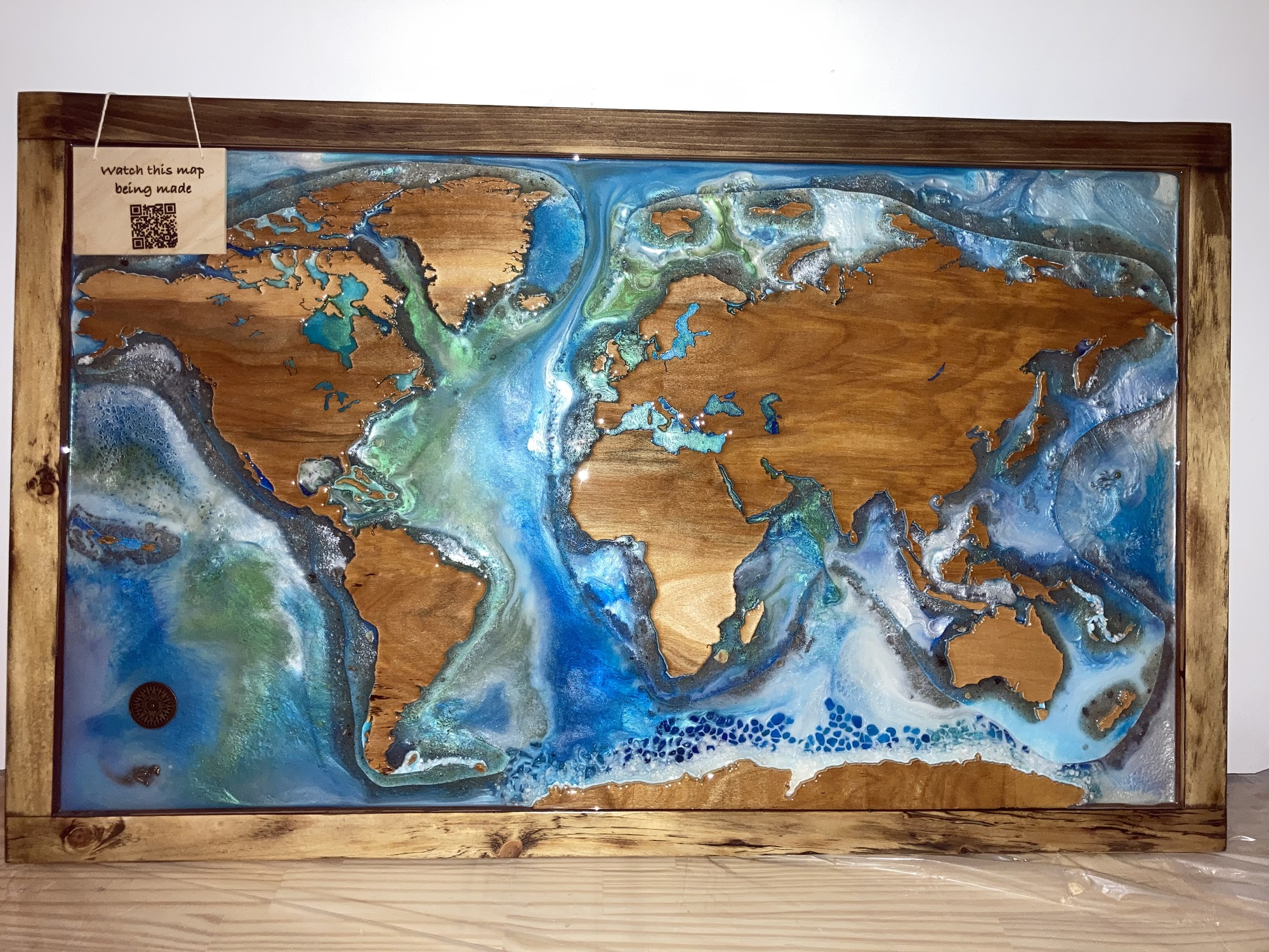 World Map
Size: 40x24 inches

This world map is a great conversation piece and at 24x40 is the perfect size for over a fireplace or in an entry way. This unique piece will make an unforgettable impression on anyone who sees it.

This piece was created with hand-cut reclaimed wood and epoxy resin - no laser cutter or CNC used. Each piece is unique. The frame has marks from the wood's previous life. The map is reclaimed birch. The epoxy
resin used is non-toxic, food-safe and no-VOC.

When choosing products for your home that contain resin please know what you're buying. The epoxy resin we use is much more expensive because it is non-toxic. It is formulated using the highest quality materials and therefore produces no VOCs or fumes. It is a clean
system, meaning there are no solvents or non-reactive
diluents - everything in it reacts so nothing is free to become airborne and cause health issues. Our resin is so safe it can be safely used as a food contact surface.