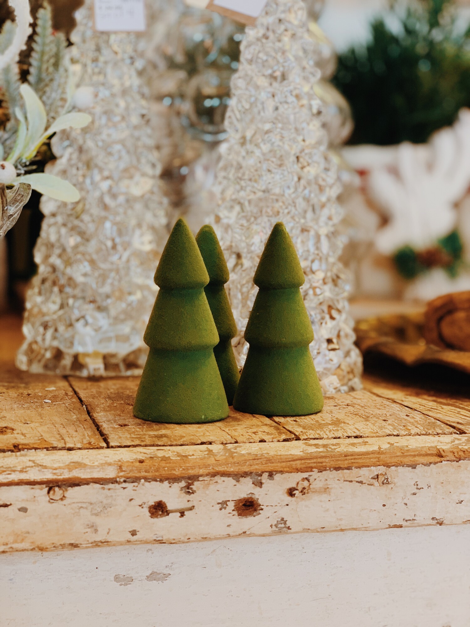 These adorable little trees measure 3.75 inches tall. They are ceramic with a velvet-like covering on the outside!