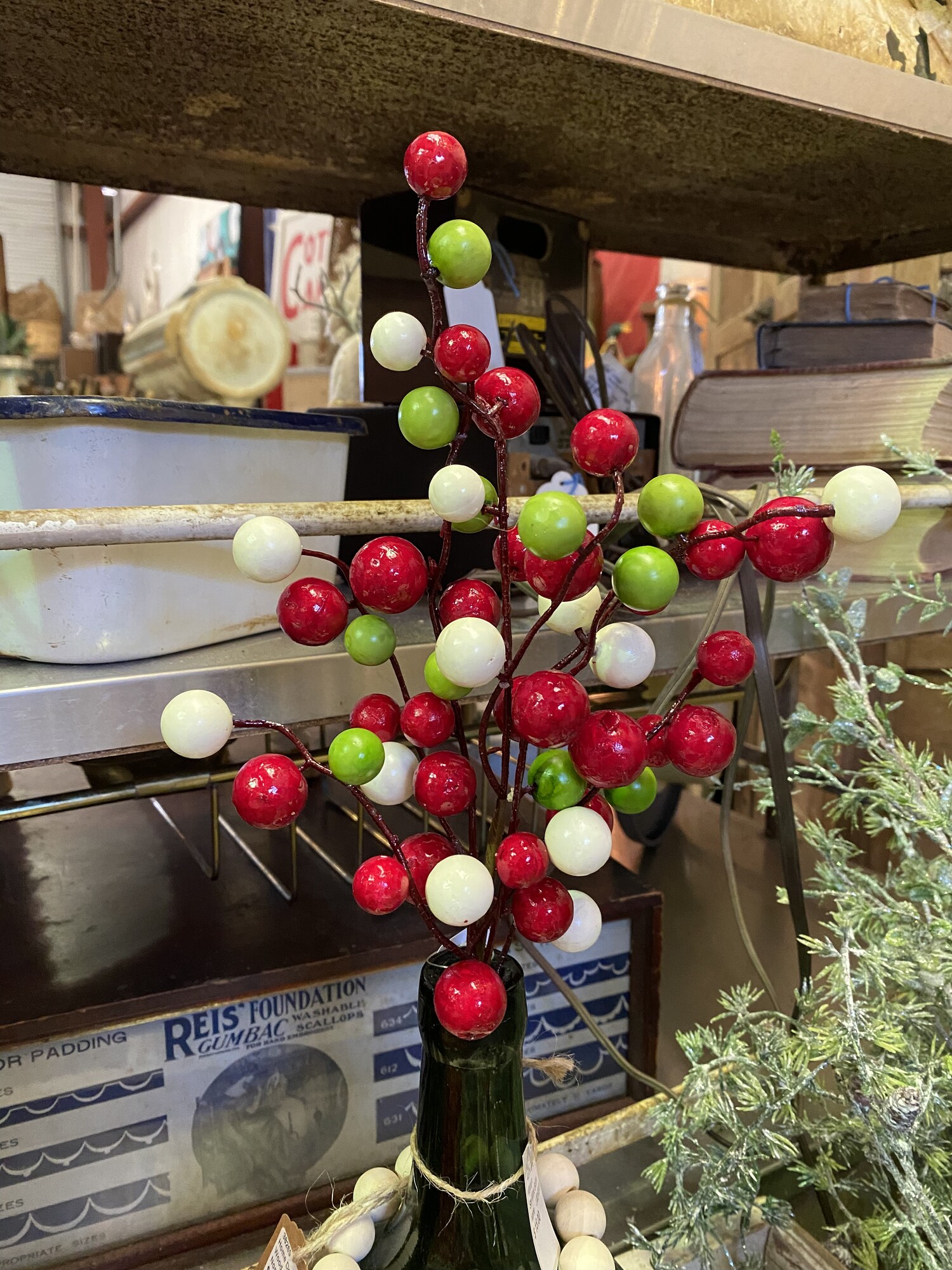 This stem measures 16 inches in length and has large red, white and green berries.  Stem looks great on its own or in an arrangement