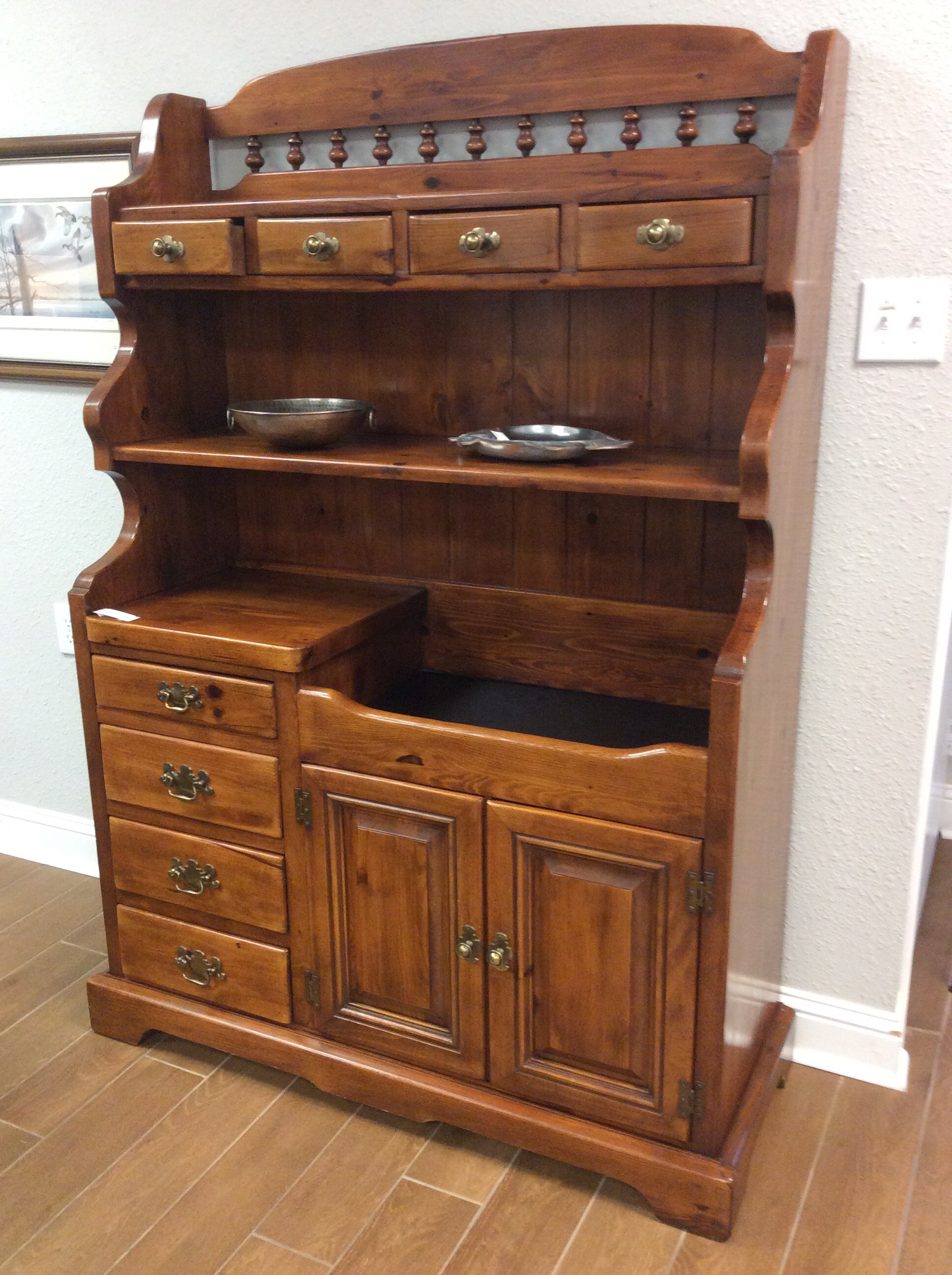 You don't see these very often now days!
This dry sink has plenty of storage. It has four drawers and a shelf on the top. In the middle it has a dry bar and a shelf. The bottom has four drawers and two doors for storage.
Measures 48x19x69