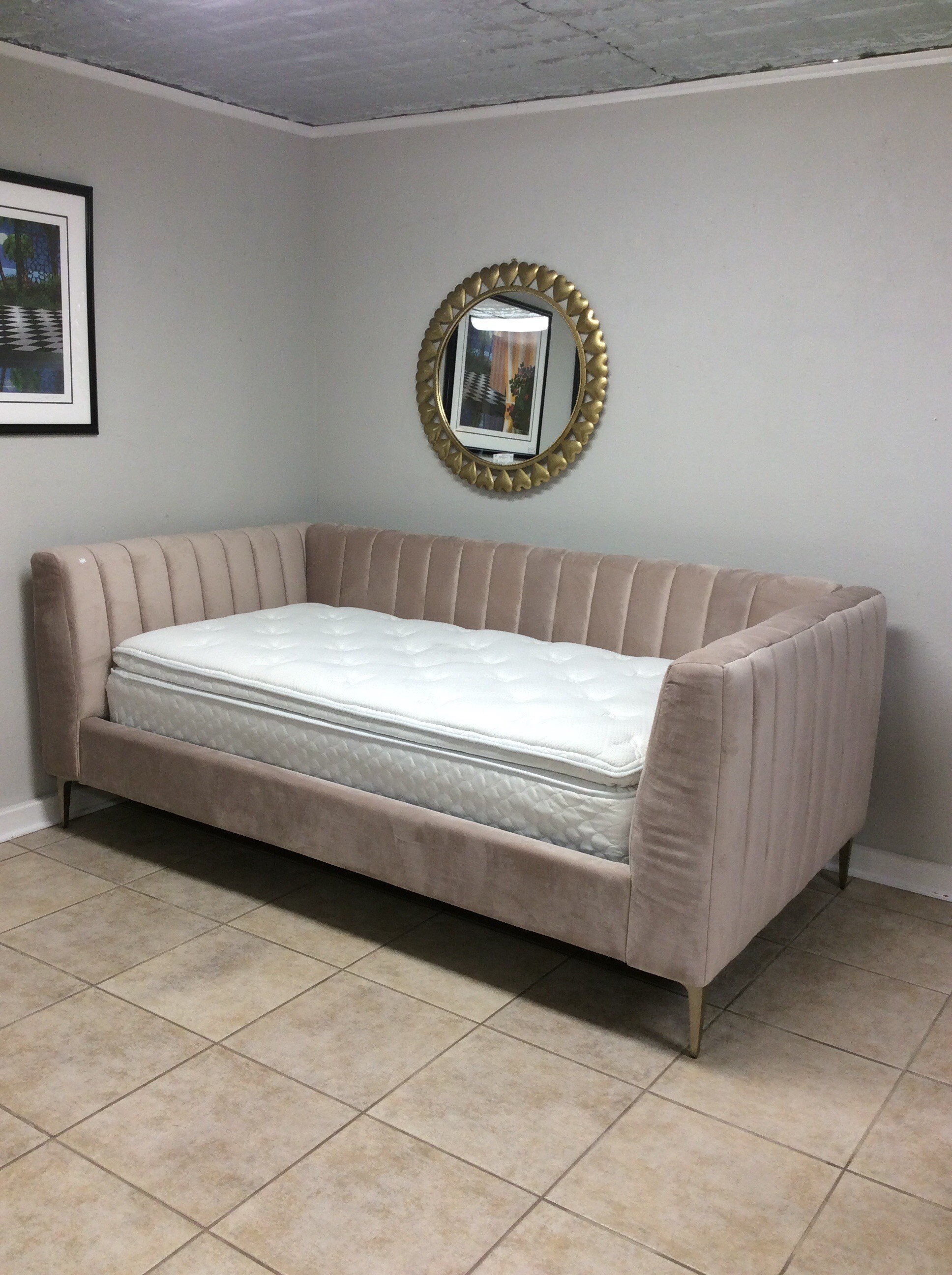 Oh, so feminine and plush! This twin-size daybed from Pottery Barn has been upholstered in blush colored velvet. The mattress is in perfect condition too.