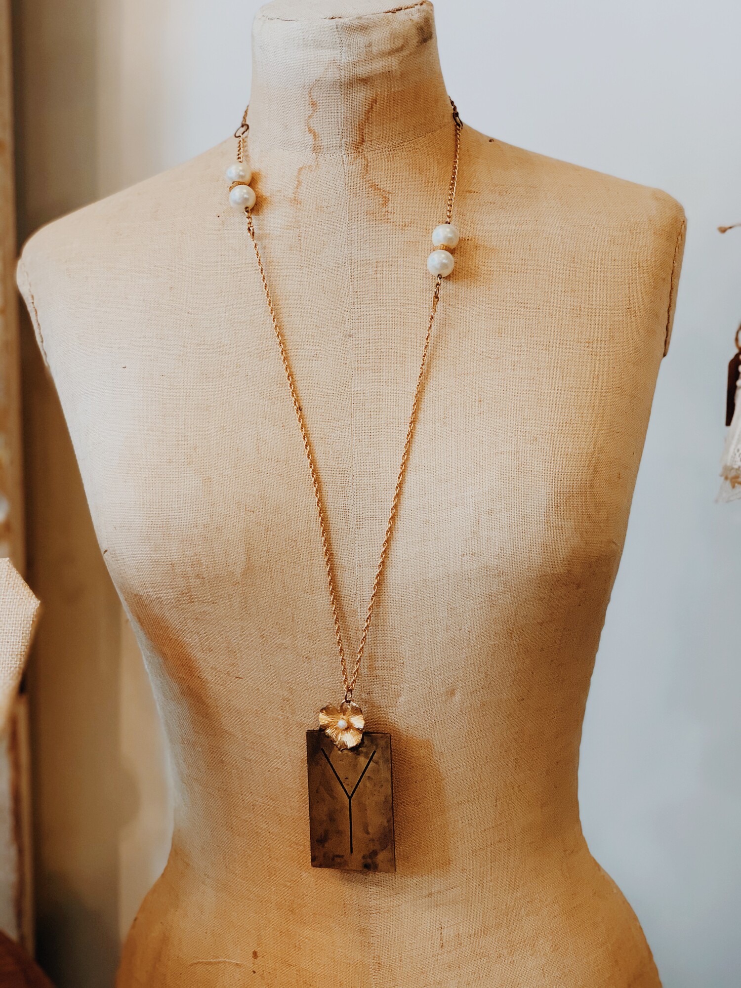 This lovely, handmade necklace is truly one of a kind! It was elegantly crafted and has a Y initialed brass plate. It is on a 32 inch chain.