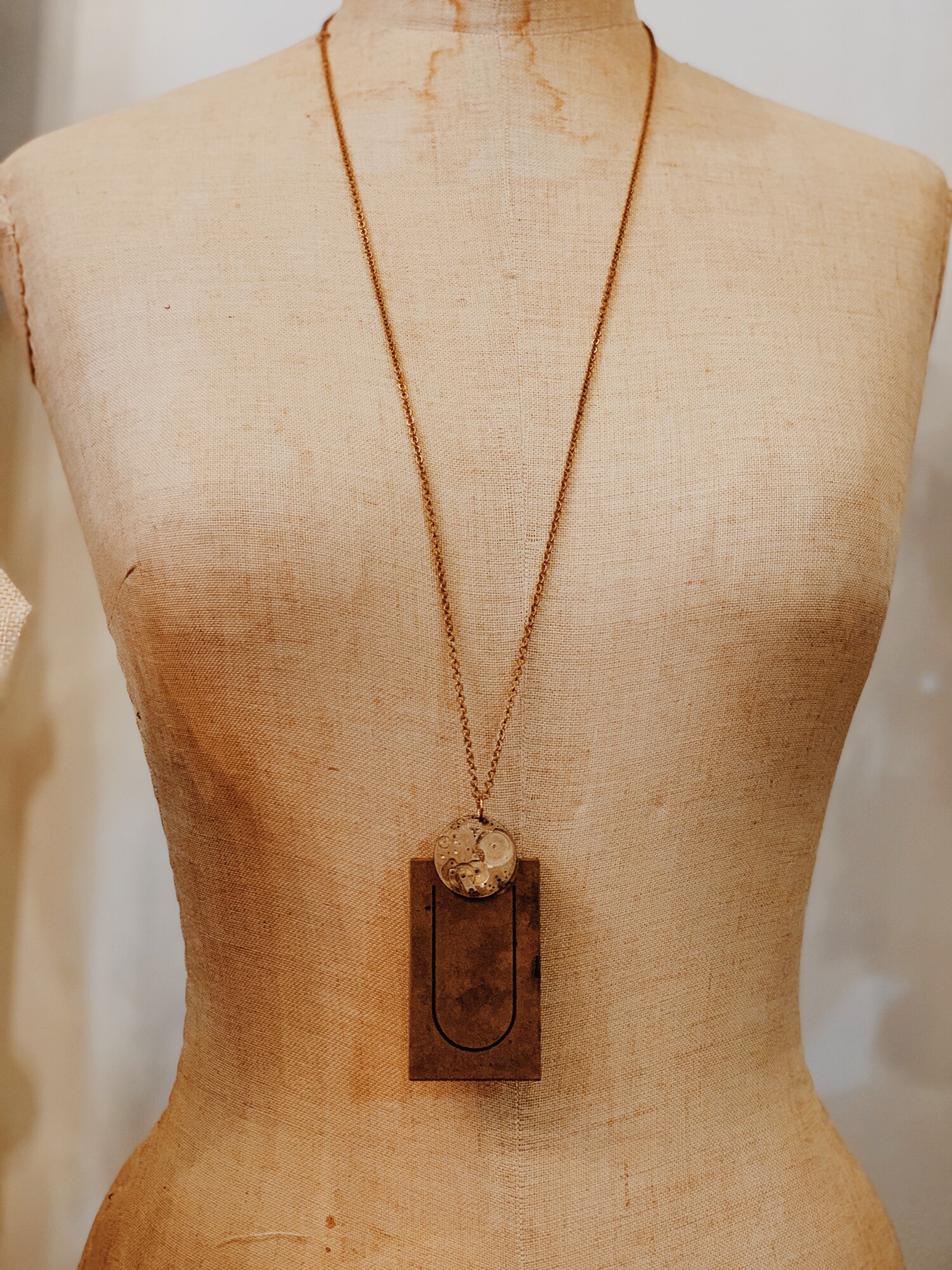 This lovely, handmade necklace is truly one of a kind! It was elegantly crafted and has a U initialed brass plate. It is on a 32 inch chain.