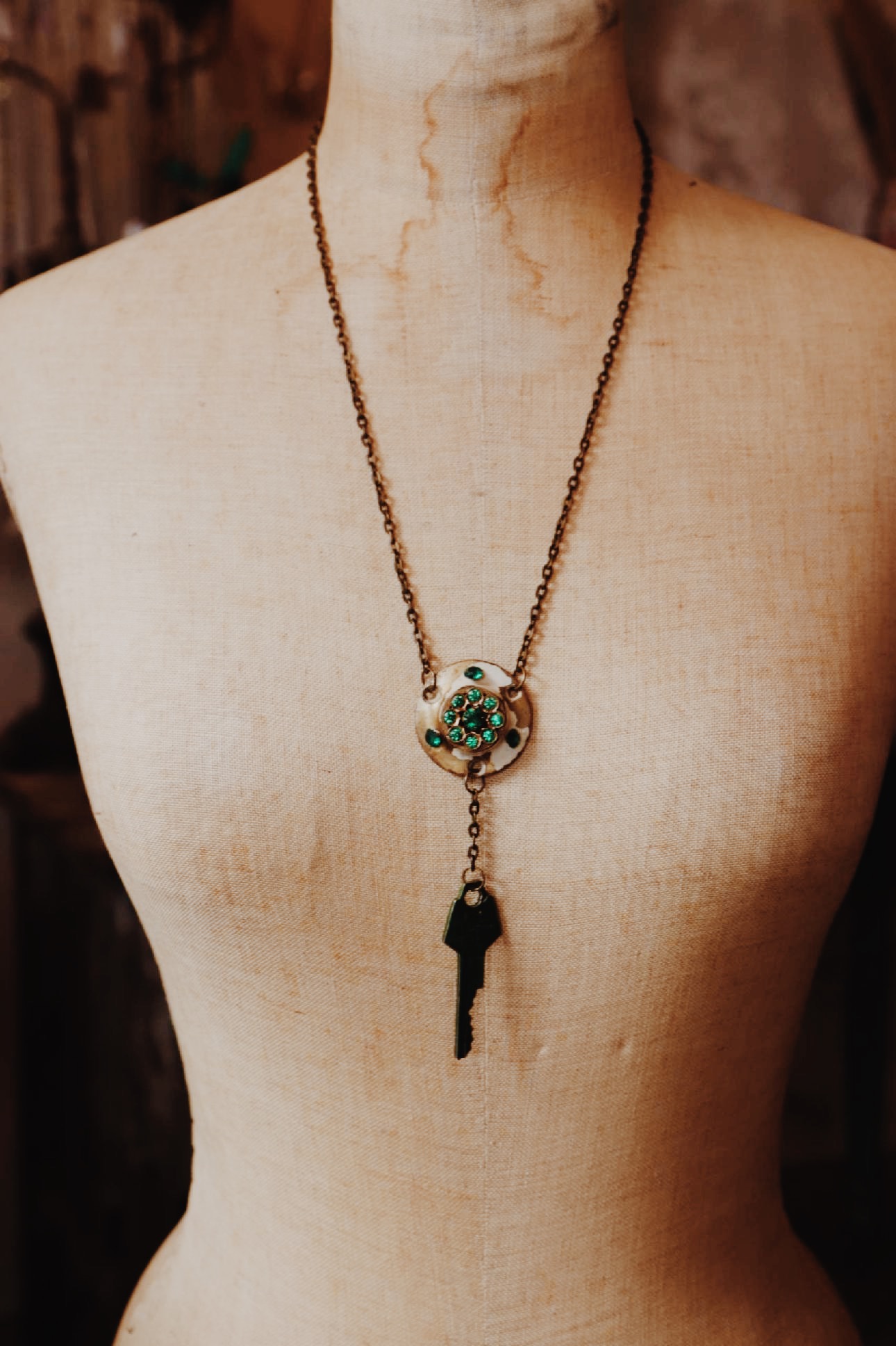 - Handmade necklace
- Vintage door lock and key
- Green accent pieces
- 24.5 inch brass chain