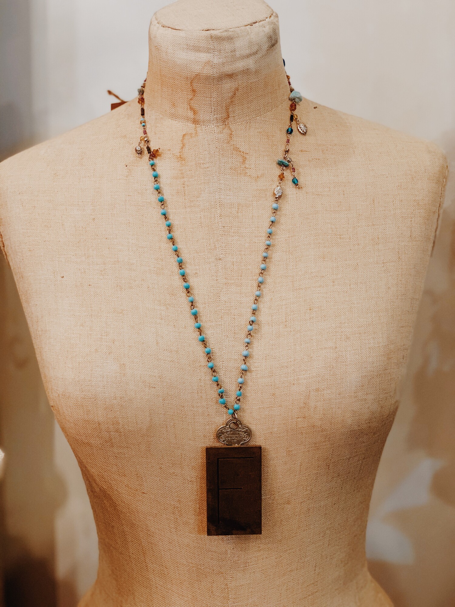 This beautiful necklace was handcrafted and is strung on a 27 inch chain with a 2 inch extender.