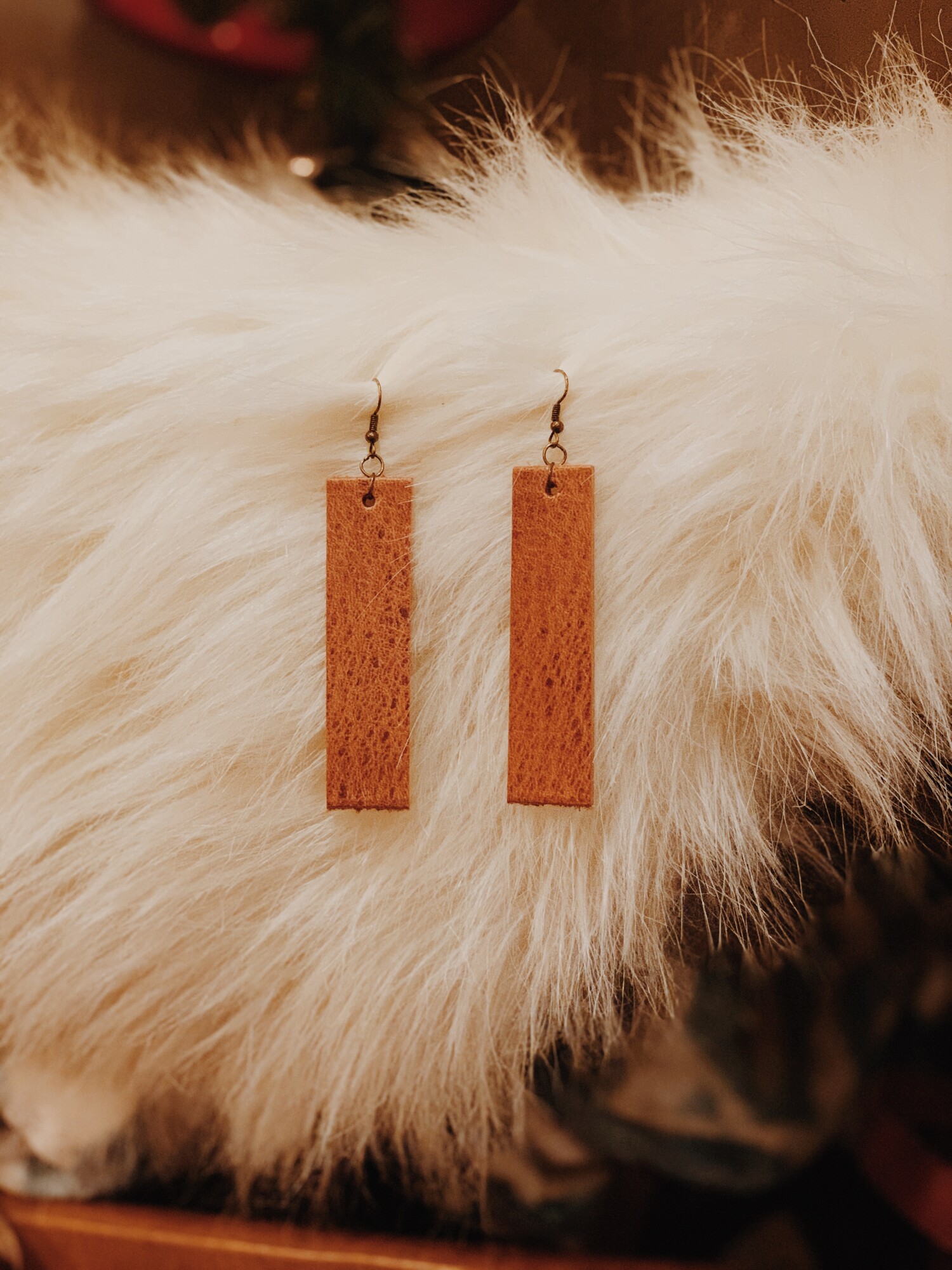 These genuine leather earrings from The Olive Branch were carefully designed and hand crafted! They measure 4 inches long.