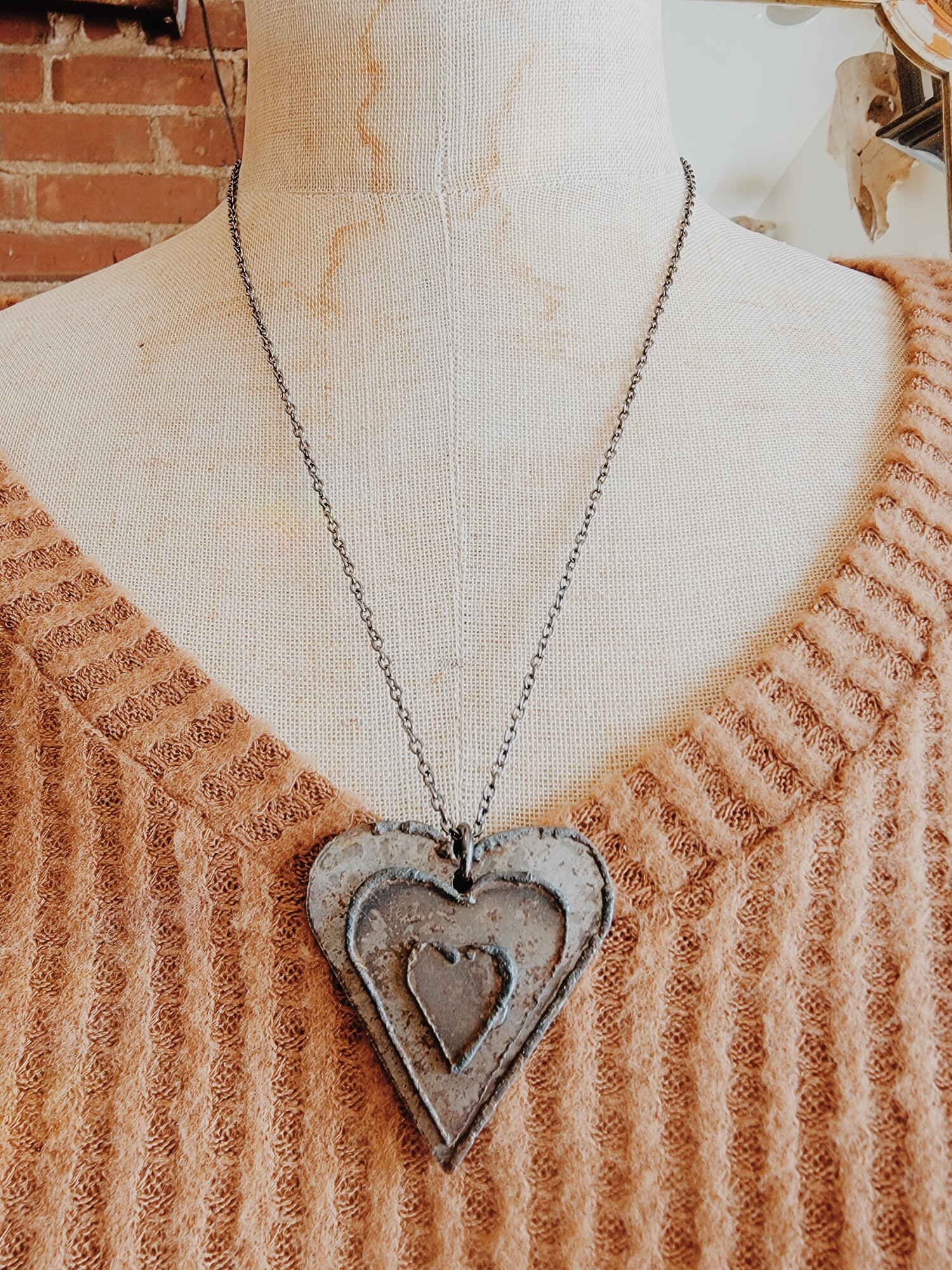 These adorable metal heart necklaces are on a 22 inch chain and were hand crafted!