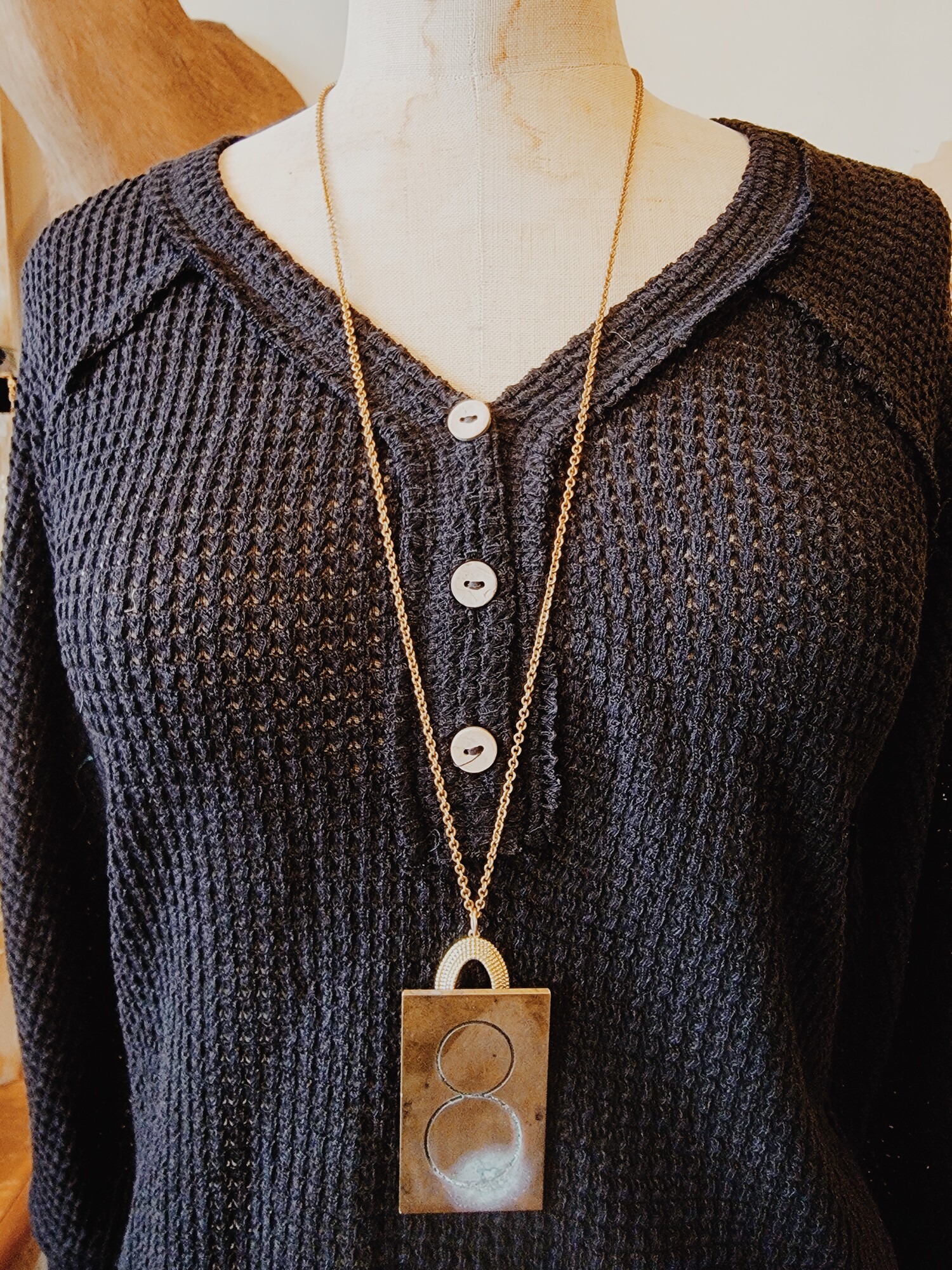 This neckalce with an 8 engraved brass plate was handmade! It is on a 34 inch chain.