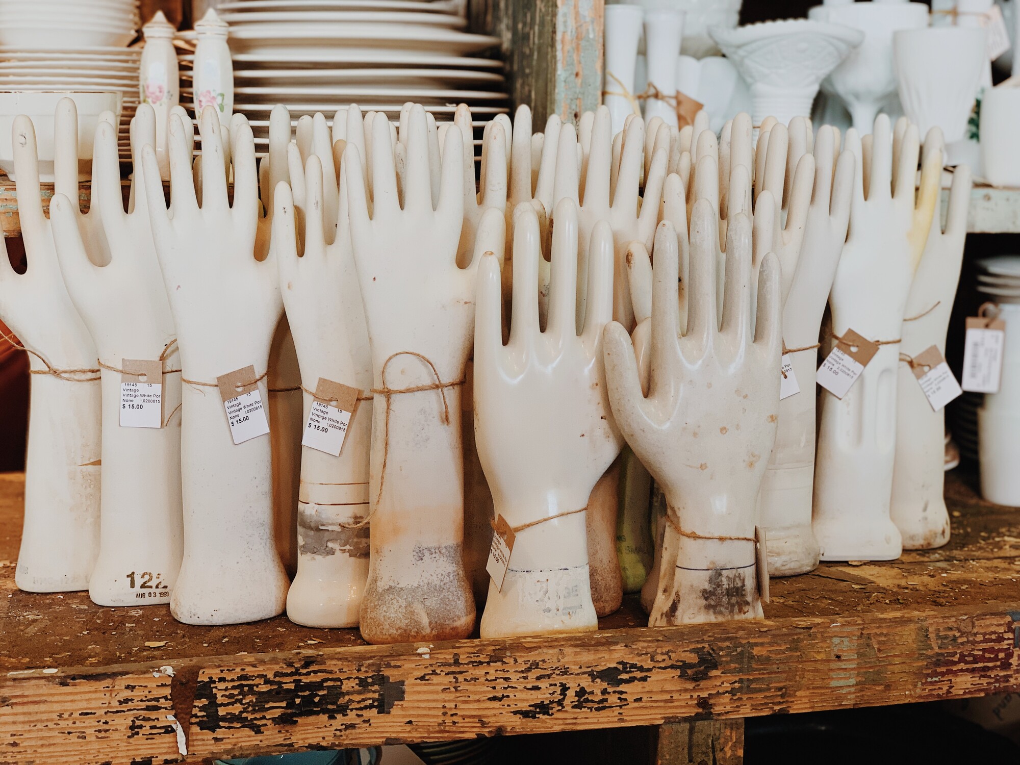 The coolest are these vintage white porcelain hand glove molds. These are great decor on a bookshelf in three's or five's. Each one measures 14 1/2 inches x 5 inches.