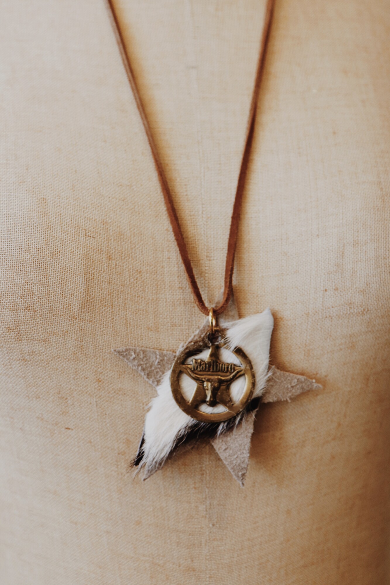 This Kelli Hawk Designs necklace is on a 29 inch leather cord and has a vintage Marlboro metal piece on leather as the pendant!
