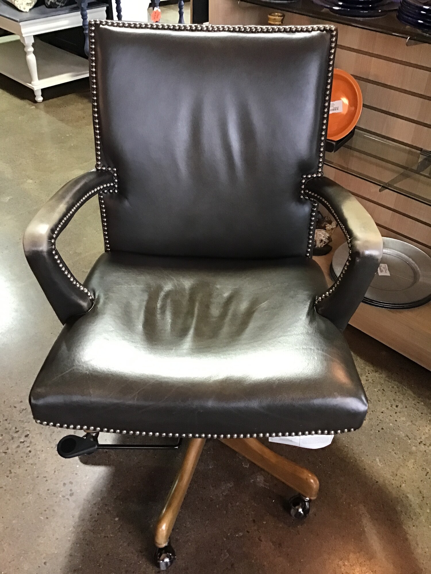 This super comfortable leather desk chair from Arhaus would make the perfect chair for your home office! It is upholstered in a medium-tone gray leather with nailhead accents. The arms are weathered and there are some scratches on the back. TONS of life still left in this piece!