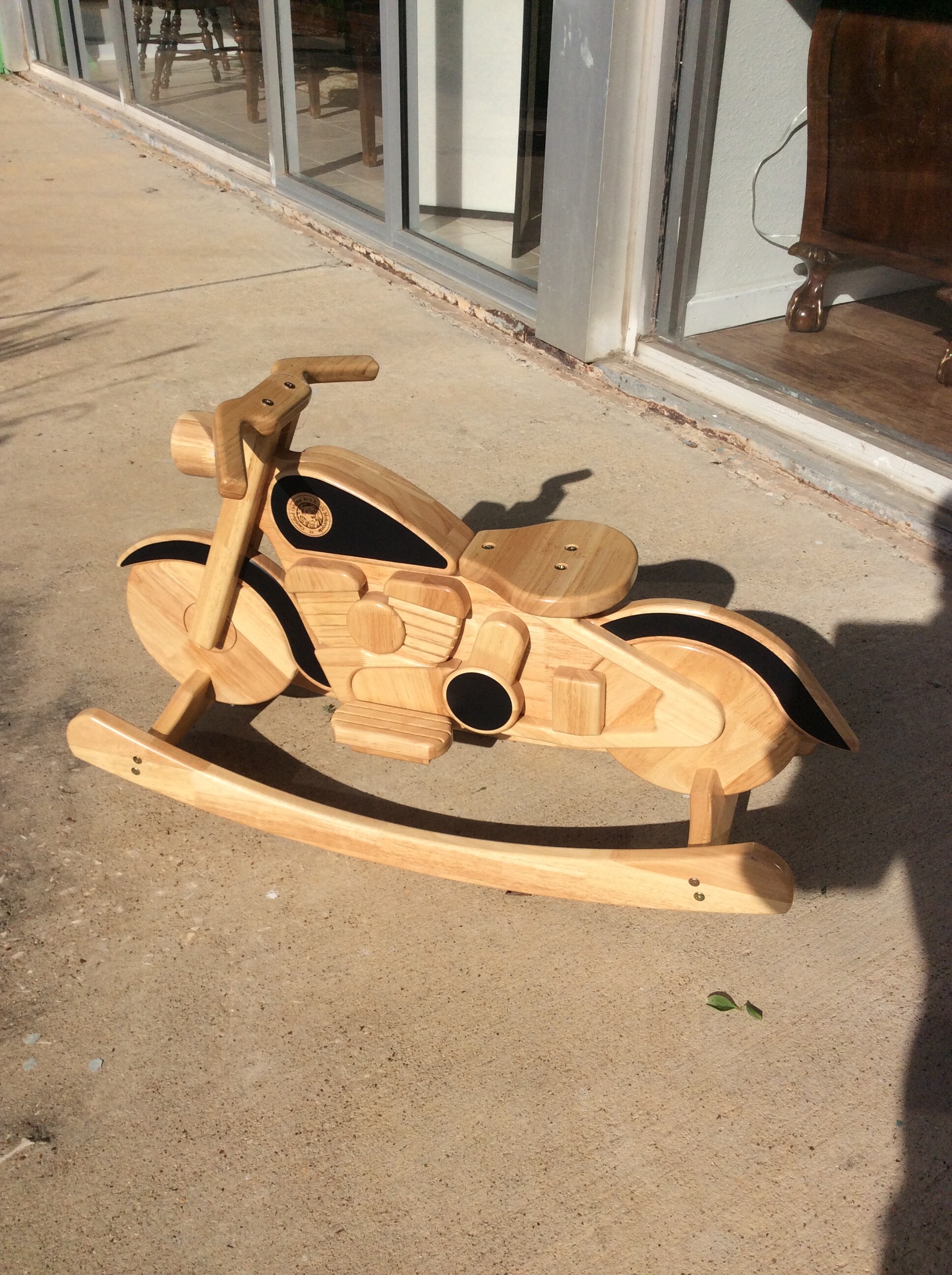 Cute Harley rocker! From East West Wood Products this is a Certified Original ROCK-ON Motorcycle.