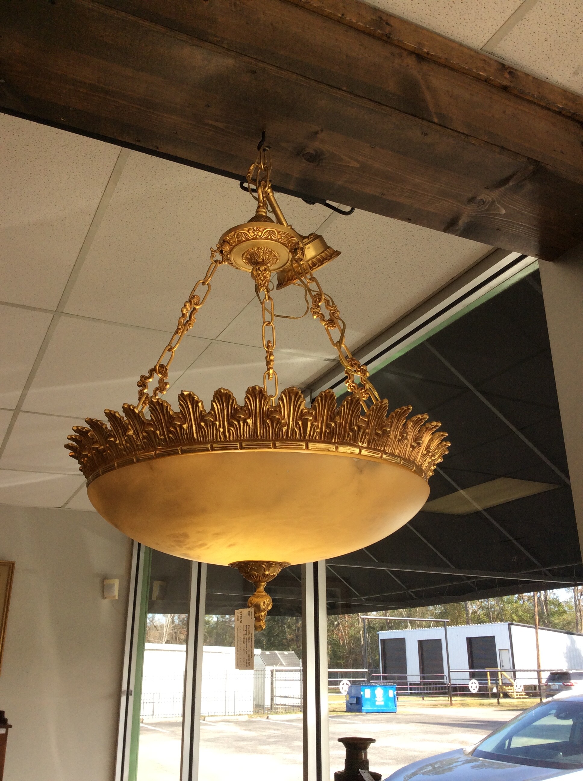 This is a pretty chandelier. It features a gold and white crown. Very vintagy looking.