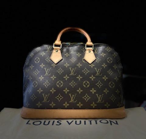 LOUIS VUITTON - Vintage
MONOGRAM CANVAS ALMA PM
The timeless Louis Vuitton Alma rendered in the house's signature coated Monogram Canvas with natural Vachetta leather trim and accented with gold-tone brass hardware.
-Some things in life age like fine wine- luxury accessories included. I have a true love and appreciation for heritage luxury that has lived quite a life, perceiving darkened patina and marked Vachetta to be an indicator of a well-traveled item. The addition of true vintage amplifies any collection, rounding out the depth of style that sometimes shiny, new bags just cannot - even with scars and bruises - are still beautiful.
Features:
Two Leather Top Handles
Zip-around Closures
Interior Slash Pocket
Coated Canvas
Canvas Lining
Gold Hardware
Details:
Length: 12\" (30 cm)
Height: 9.4\" (23 cm)
Depth: 6.25\" (15 cm)
Strap Drop: 3.25\" (8 cm)
Date Code:  BA1904
This bag does come with its Original Duster Cover