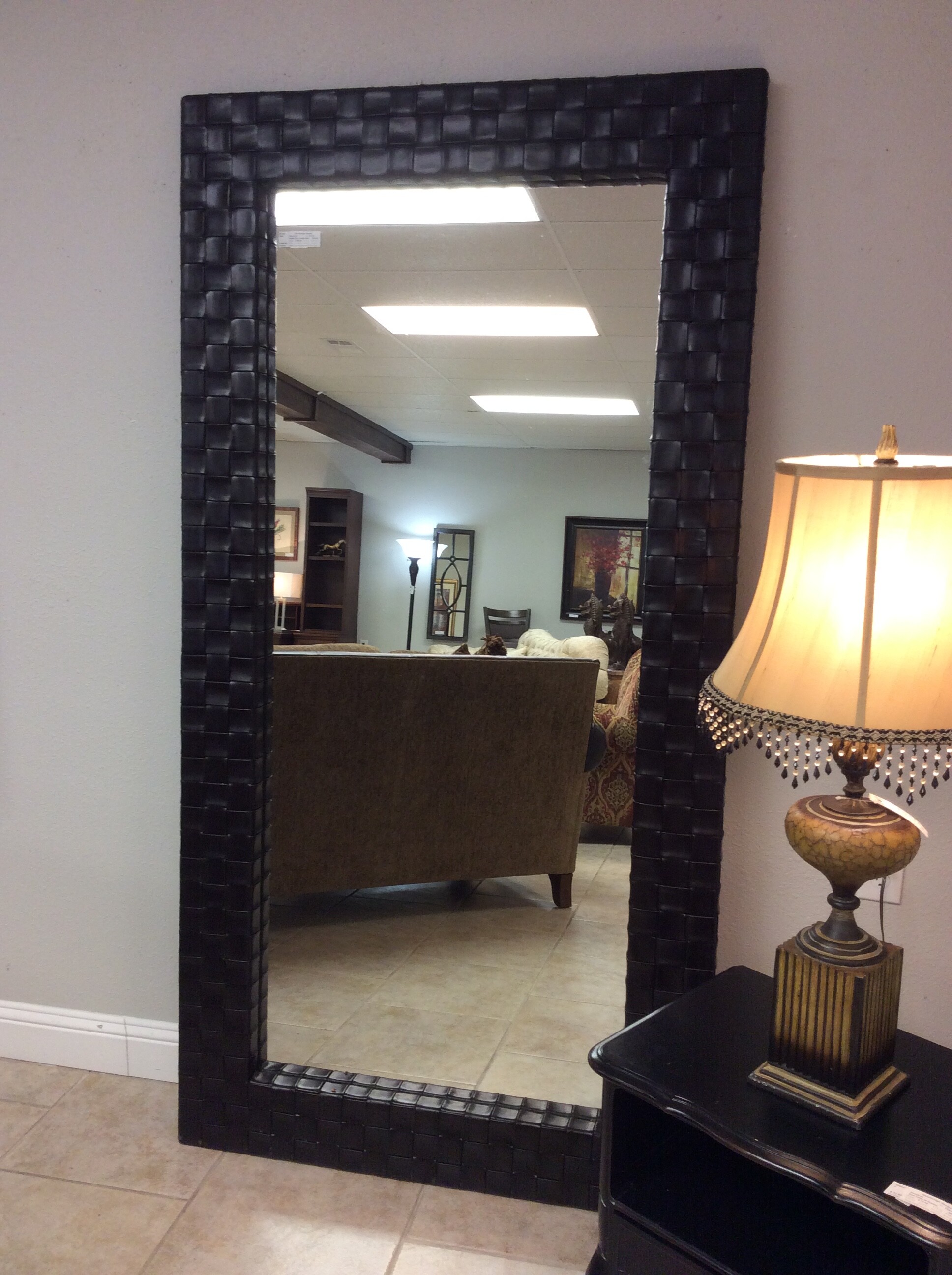 This very tall mirror has a leather basket weave. The color is Expresso/Black
Measures 81x42