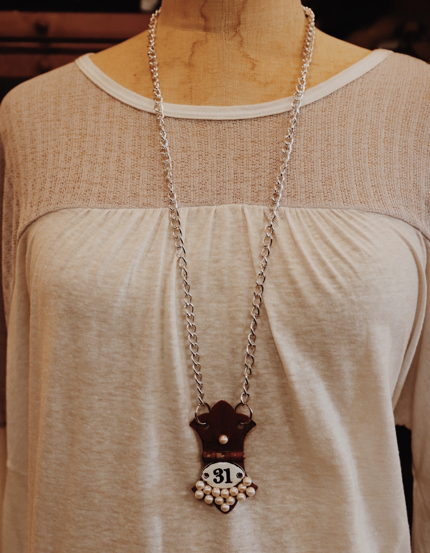 This adorable, handmade necklace is on a 32 inch chain!
