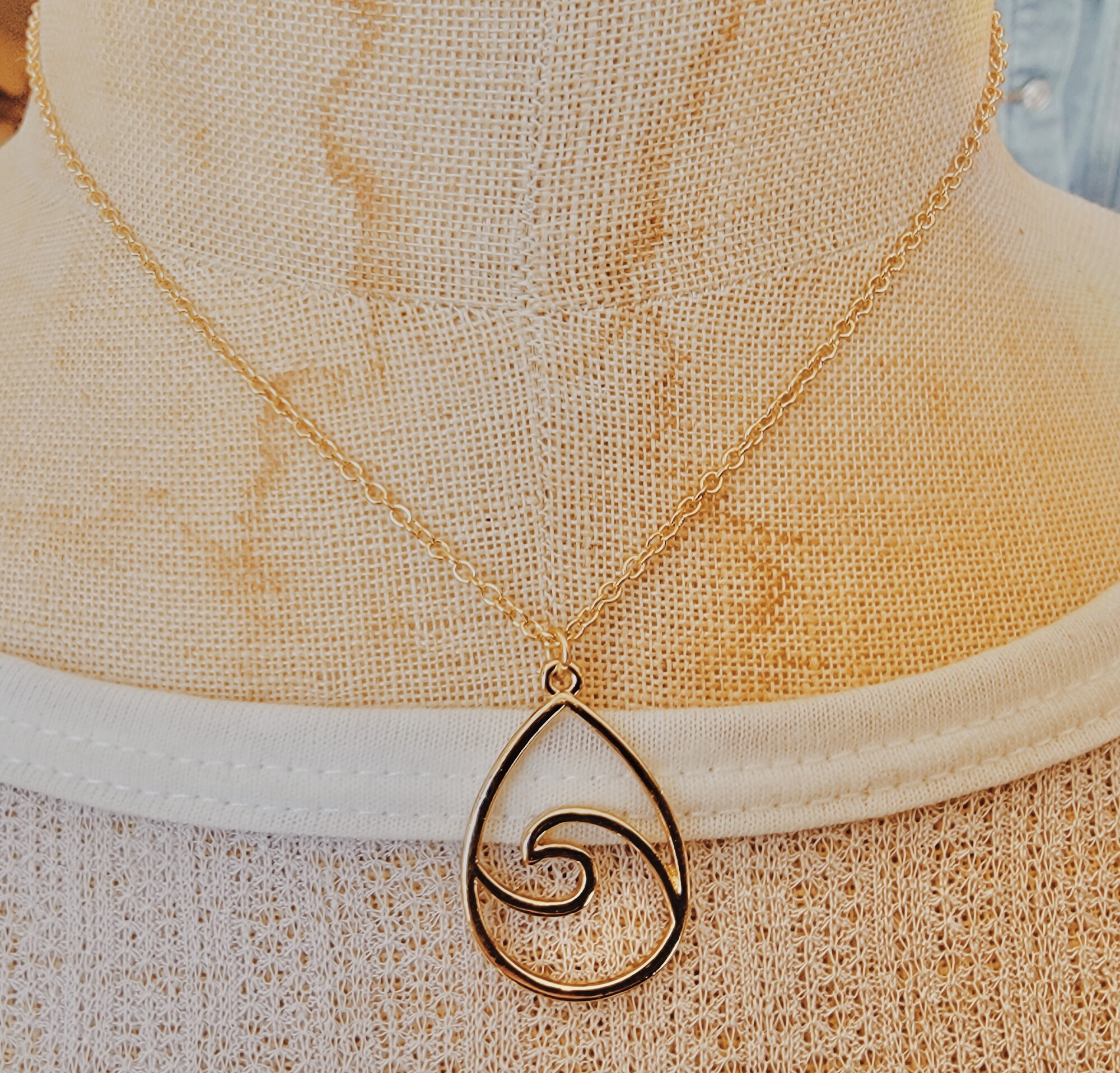 This dainty gold wave necklace is on a 15 inch chain with a 3 inch extender!