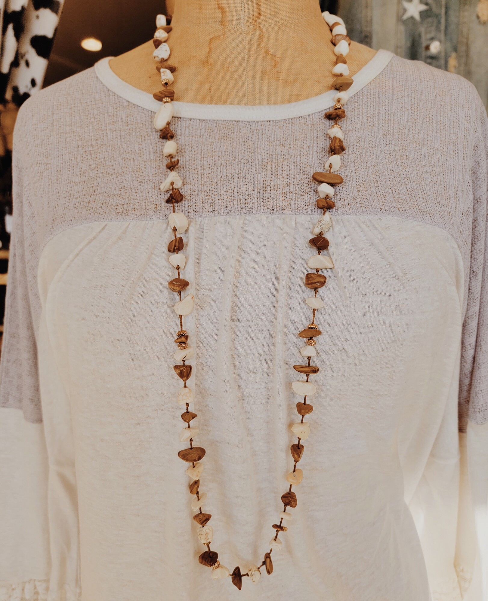 Cream/Tan Stone Necklace. This necklace is perfect for layering and is a 38 inch cord with a 3 inch extender!