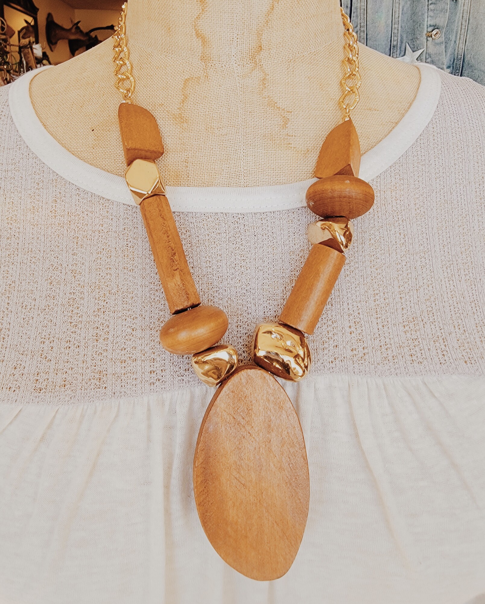 These beautiful wooden and gold necklaces are on a 22 inch chain with a 3 inch extender!