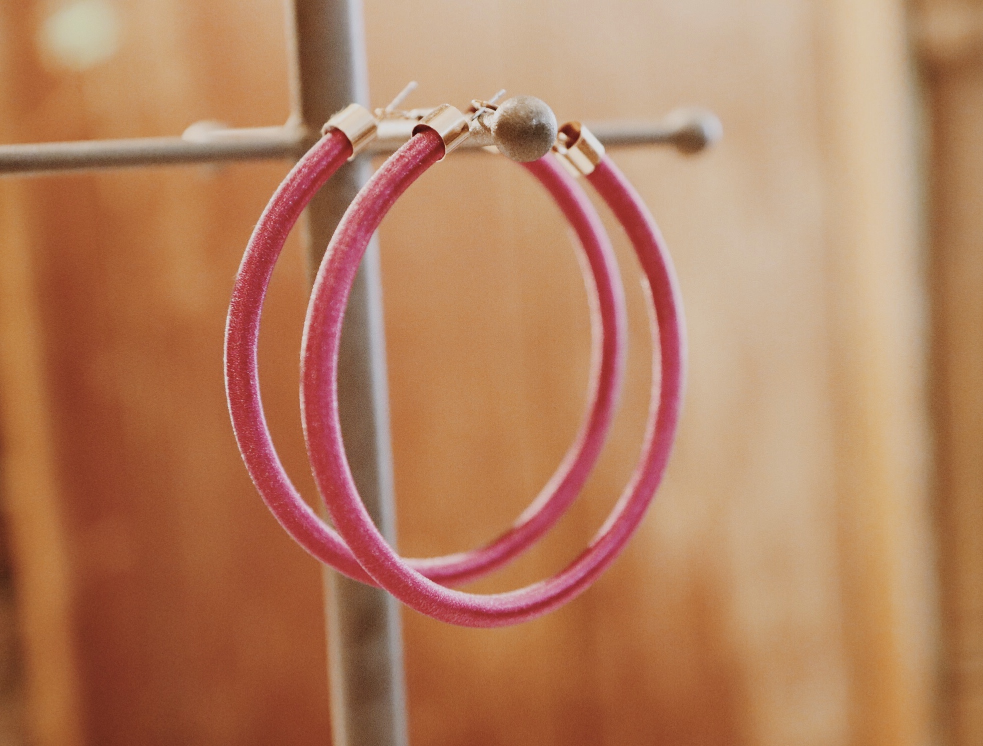 This pair of lovely magenta hoops is 3.25 inches across. The perfect pair of hoops to top off any bright outfit!