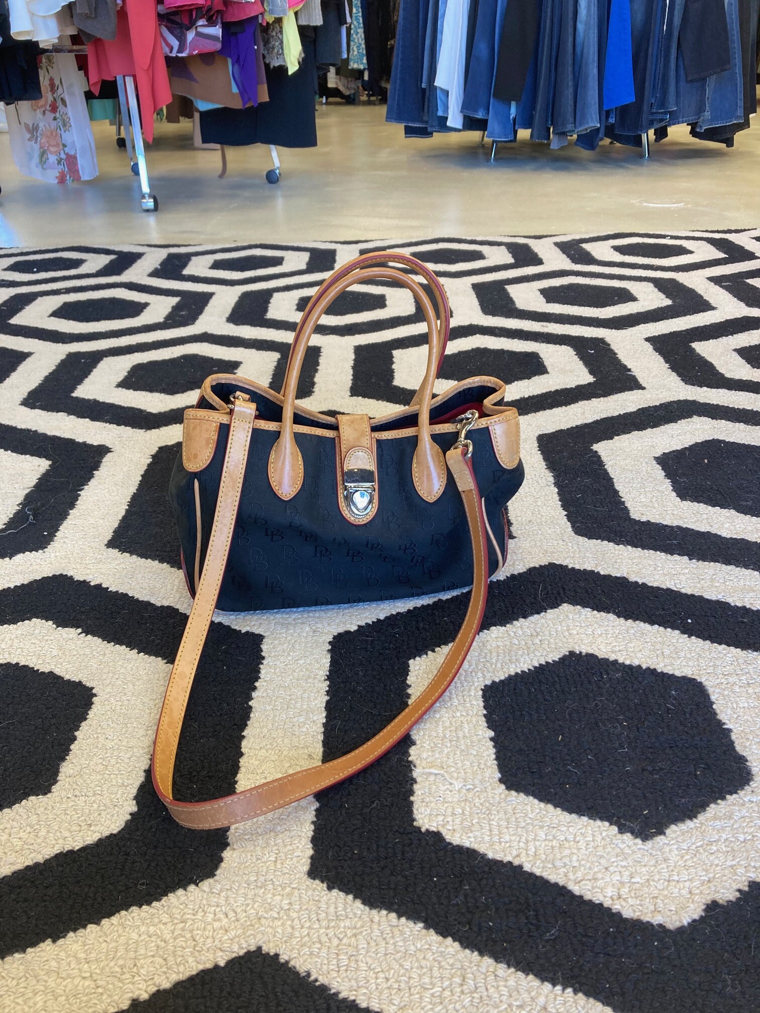 Dooney & Bourke Bag: Classic cloth and leather Dooney style.  Black and caramel color leather.  Don't miss this deal!