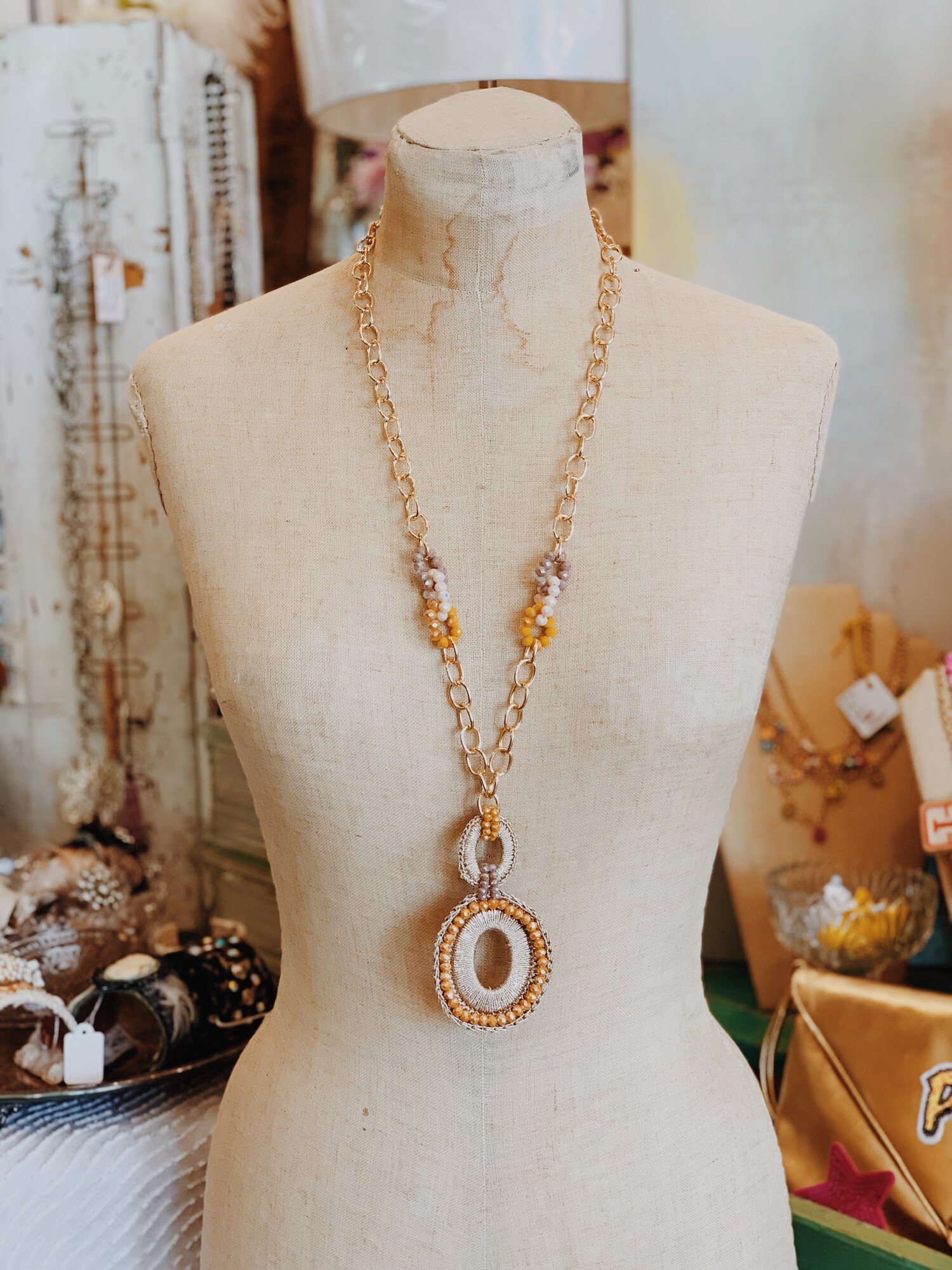This long necklace is perfect on its own or with a shorter necklace paired for layering! Such fun colors paired with this gold chain!