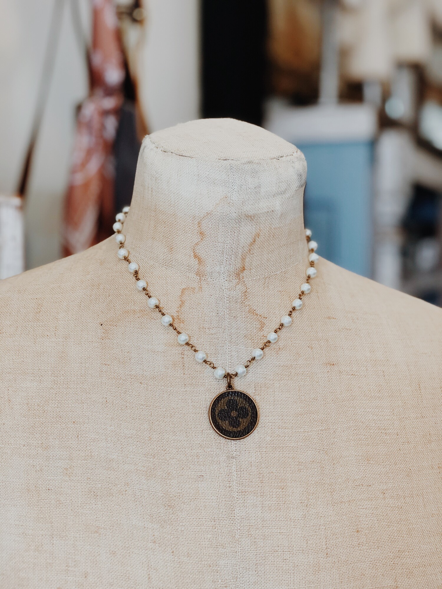 This gorgeous upcycled, handmade necklace was made from an authentic Louis Vuitton bag!

The chain measures 17 inches in length.

Resurrect Antiques is not affiliated with the LV company.
The bag's date code is SP0927