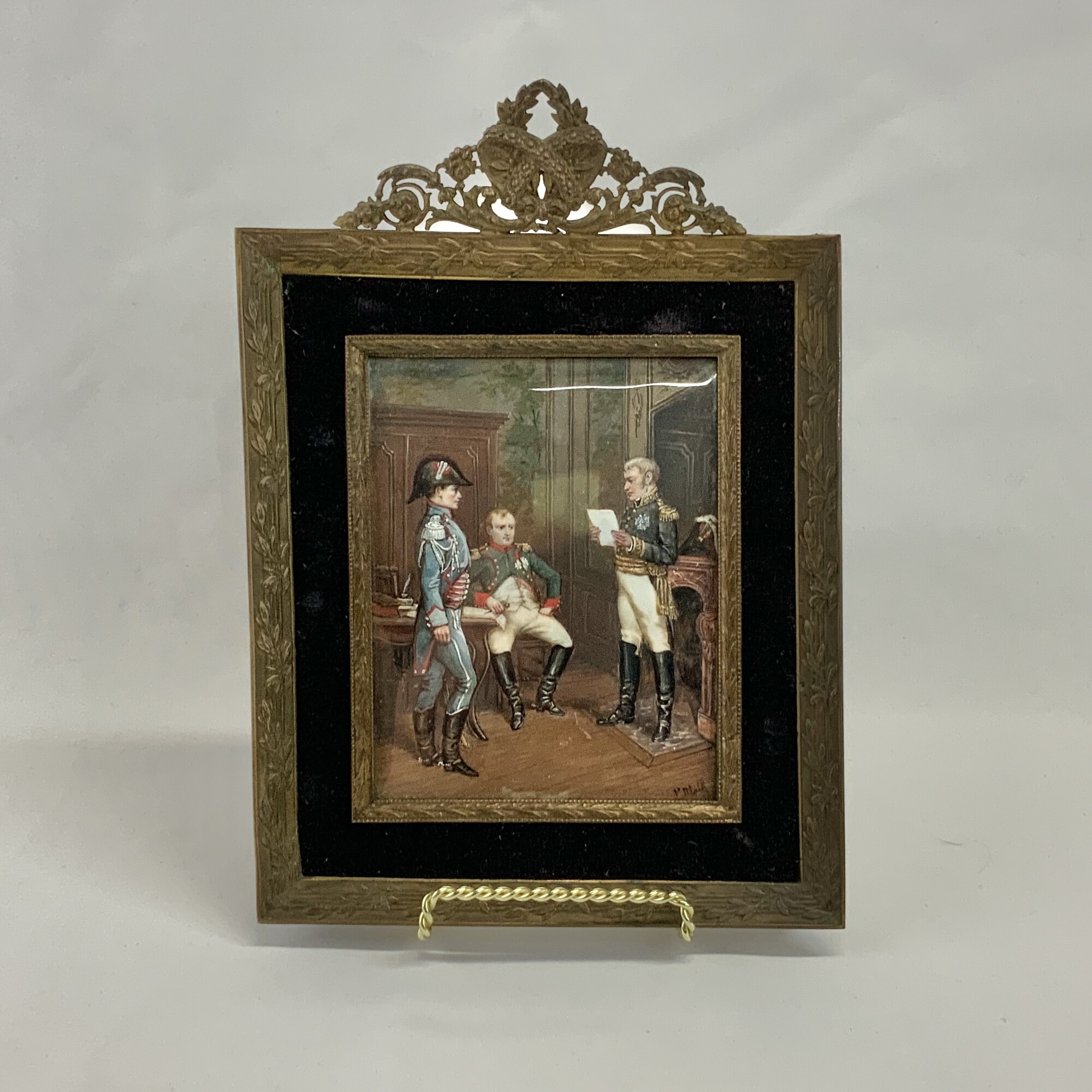 Antique ornately framed miniature painting Le Raport by P Blain Painted on porcelain it is signed and the title of the painting is inscribed on the back
The back of the frame is covered in an antique fabric.
Painting approx 5 by 4 inches  With frame 9 by 6.5 inches
Very good age appropriate condition.