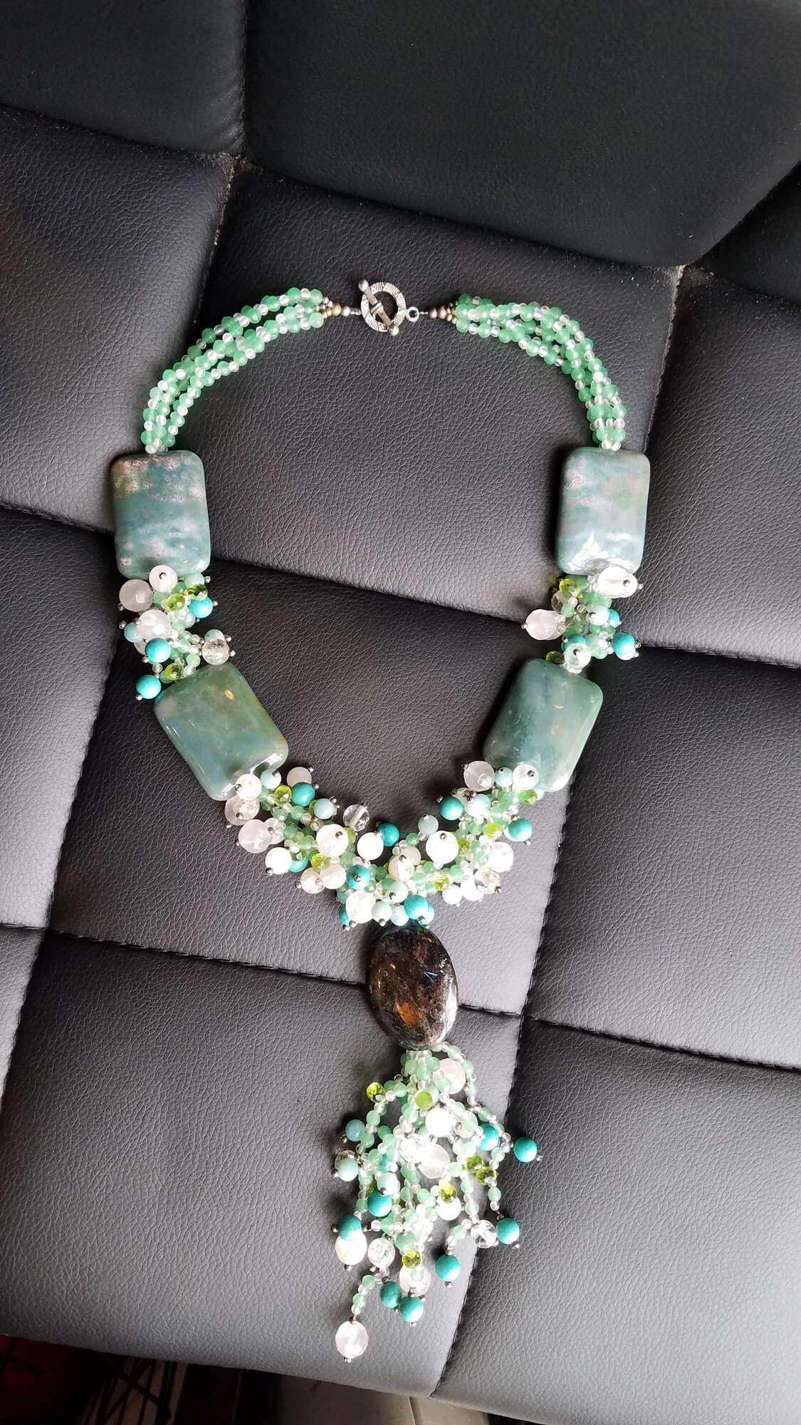 Stunning Custom Necklace of Green Agate, Rose Quartz, Peridot and Turquoise Beads.
21 inches long and weighs 241 grams
The rectangular Green Agate measures 1.5 inches X 1 inches
The Dark Oval Agate measures 1.5 inches X 1 inches
A true ONE OF A KIND