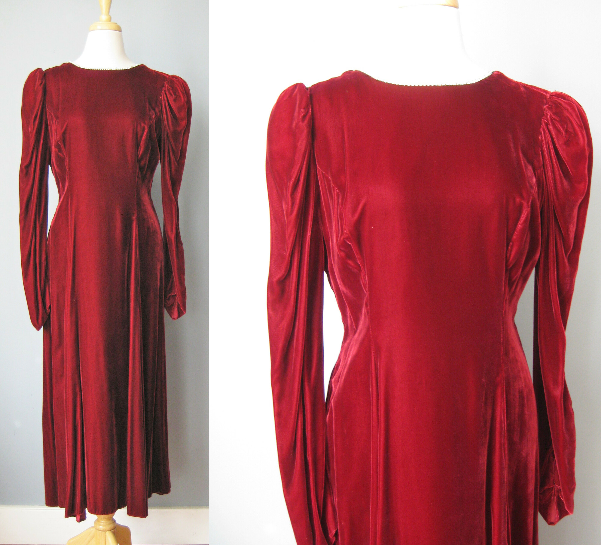 A deep rich red rayon / burgundy velvet gown from the 1980s.
Very dramatic with puffed sleeves, a high neck and a deep v open back.
The entire neckline, from and back opening are decorated with a single row of metal set rhinesontes.
 small, a bit subtle but will definitely sparkle.
The long sleeves end in a point giving the look a very renaissance feel. snap closure here
Bodice is lined
Skirt is full and fluid
Colored union label
made in the USA
It's just gorgeous and in amazing condition!

It's marked size 18 but please use measurements below, will be better on a modern size medium
Shoulder to shoulder: 14.5
armpit to armpit: 18.25
waist: 16.5
hip: up to 23
Underarm sleeve seam length: 16.5
length: 49 (probably ankle length depending on how tall you are)

Thanks for looking!
#38056