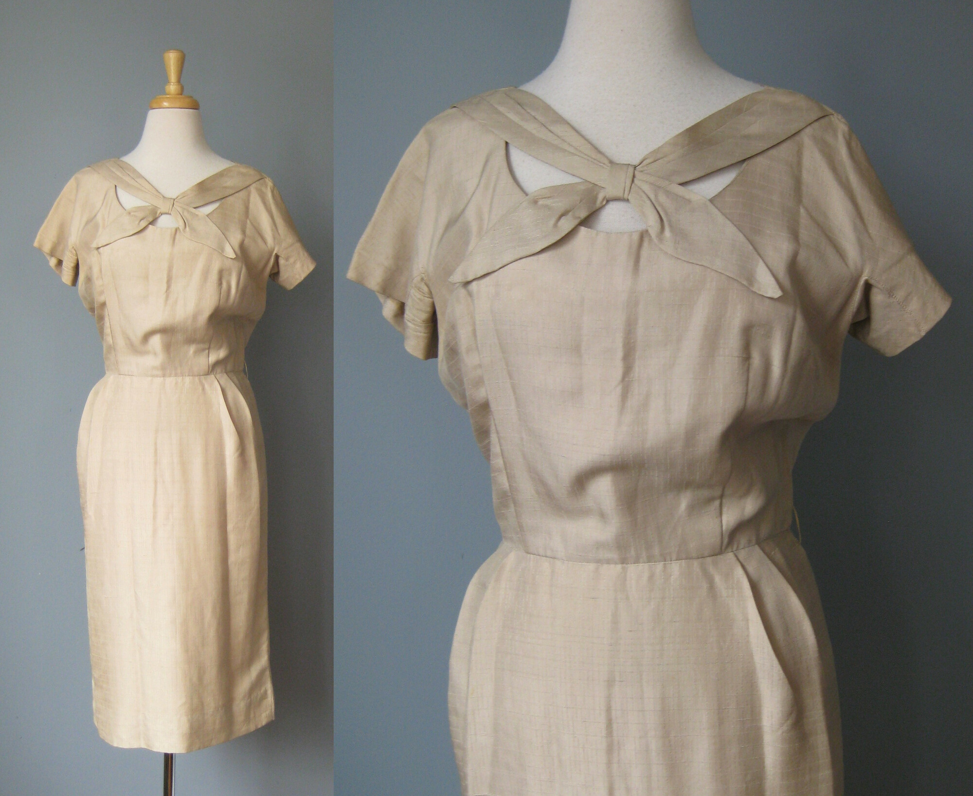 Very Smart, this slim fitting beige dress has a complex open neckline and a little flare of a train built into the back.

This dress is made of slubby silk or faux silk shantung, in great condition. It is unlined and has a metal zipper in the center back. No labels. The sleeves are cut on short sleeves.

excellent condition but with a few spots as shown in the photos, mostly in the back.

Here are the flat measurements, please double where appropriate:

Armpit to Armpit:  18.5
Waist: 14 1/2
Hips: 19 1/4
Overall length: 41

Thanks for looking
#42825