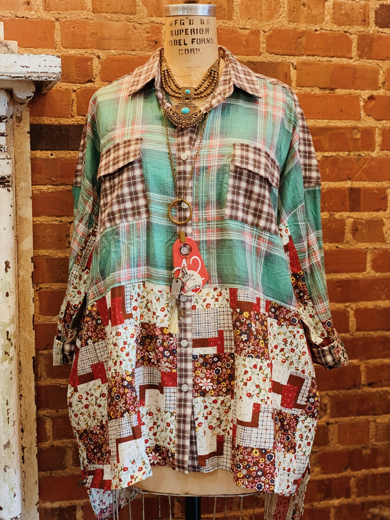 This adorable patchwork shirt is perfect on its own, or you can pair it with a tee! The fabric is a medley of flannels, plaids, and florals!