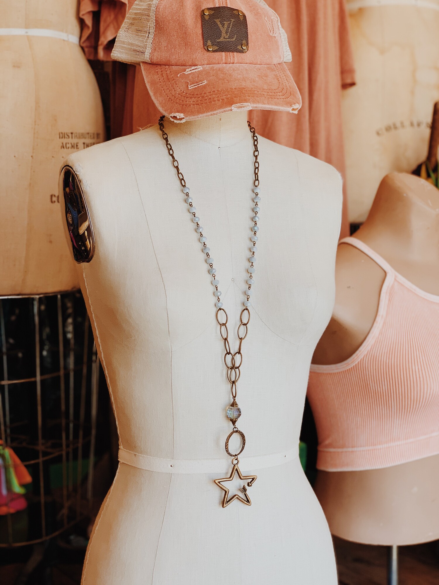 This handmade necklace is on a 32 inch chain made of multiple chain types! The pendant is a gorgeous arrow in the shape of a star!