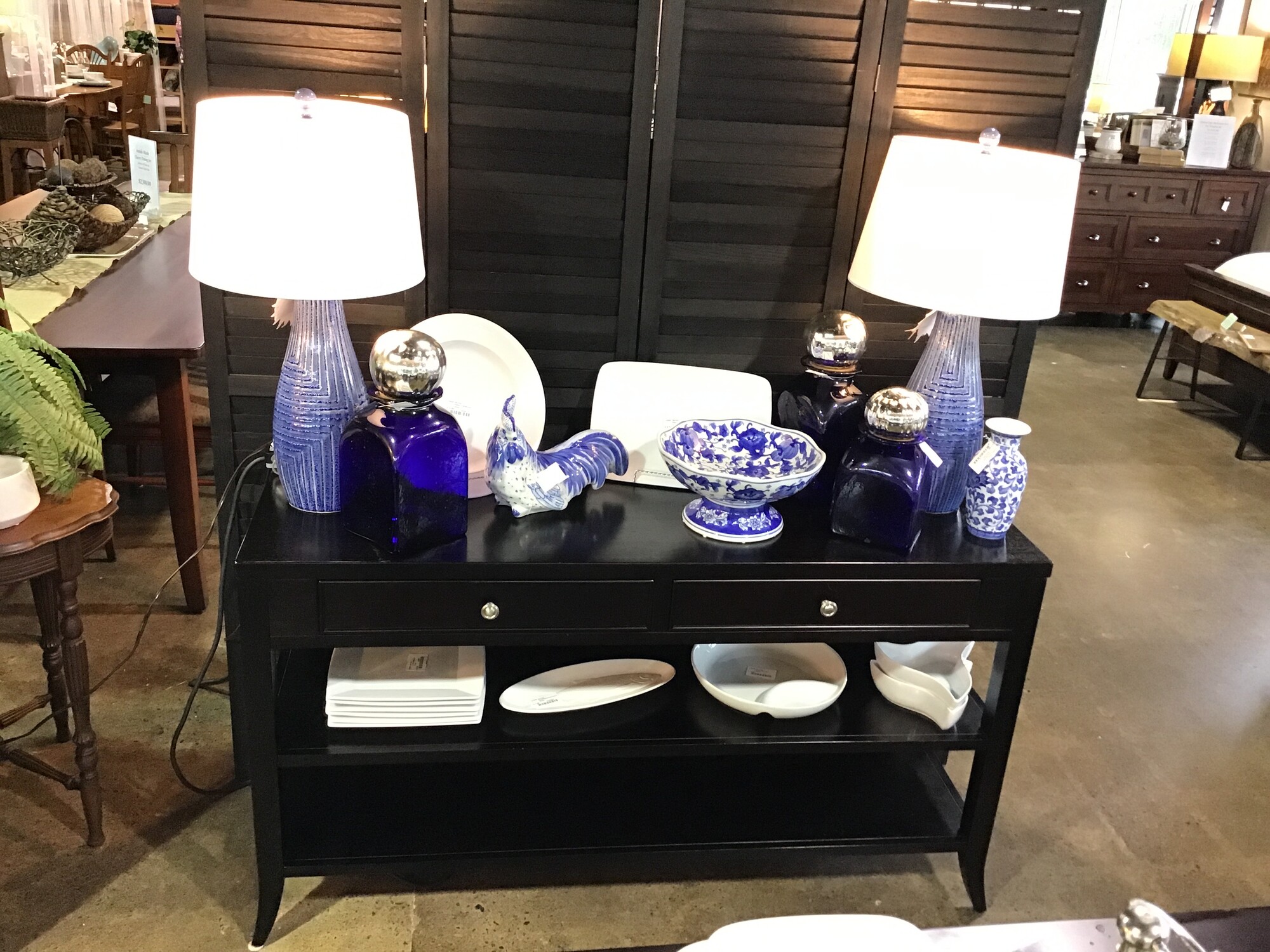 This is one of those pieces that can be used in so many different ways, that it is hard to pick what category to put it in.  Made by Arhaus.  Featuring two drawers accented with nickel knobs and two lower shelves, all finished in black.  This could be a media stand, a buffet, an entryway table or a sofa table!

Dimensions:  54x18x30