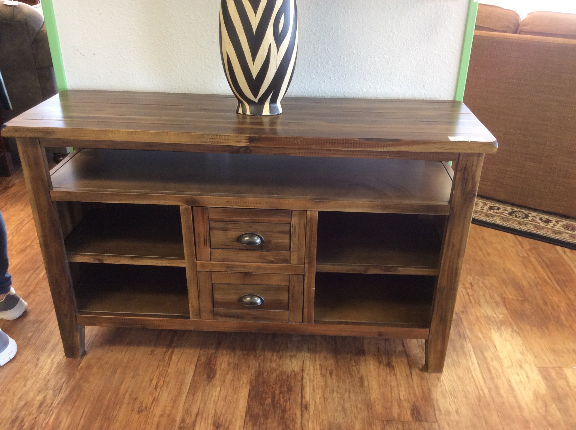 This Rusitc Wood Media Center has a awesome butcher block wood style top for the perfect farm house look. This media center features 2 small drawers and 4 cubbie hole shelfs for extra decor.