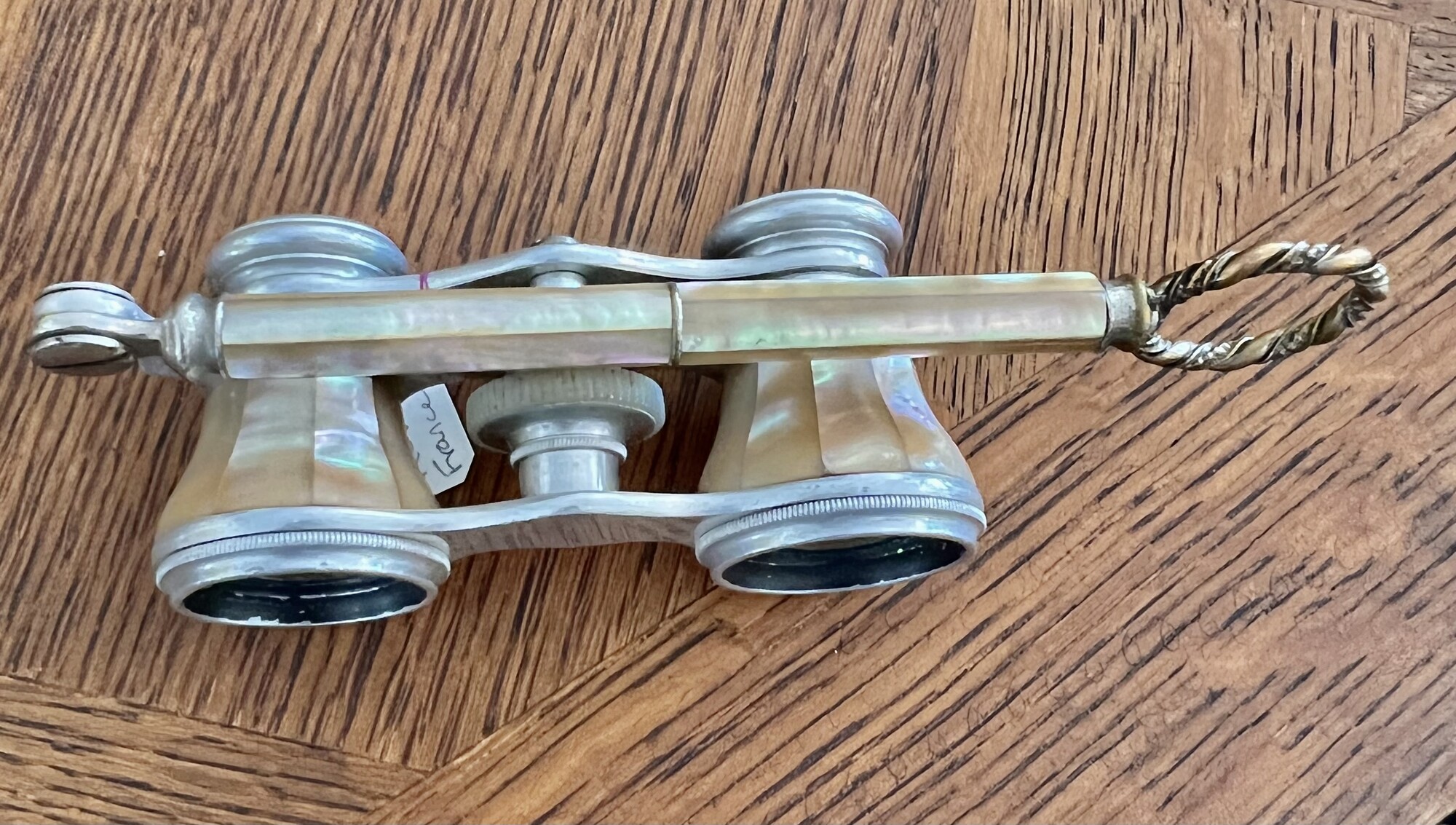 Antique Mother of Pearl Opera Glasses with folding handle. Still work perfectly!
Will ship USPS Priority mail.