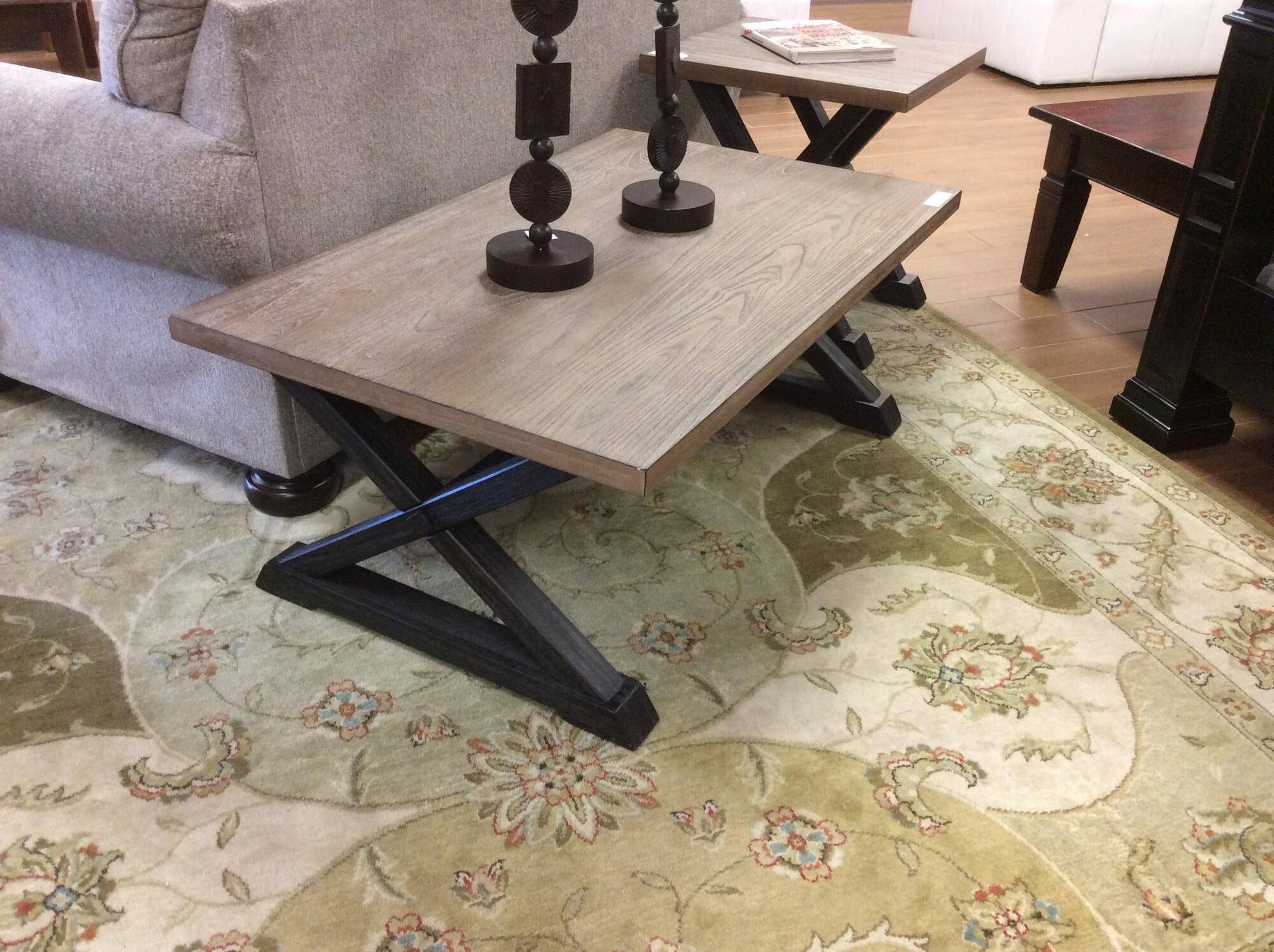 This is a Rustic, Weathered Light Brown Wood Coffee Table and End Table. Both Coffee Table and End Table have the Barn Door \"X\" Dark Stained Legs. These pieces come from Yaxin Furniture Company.