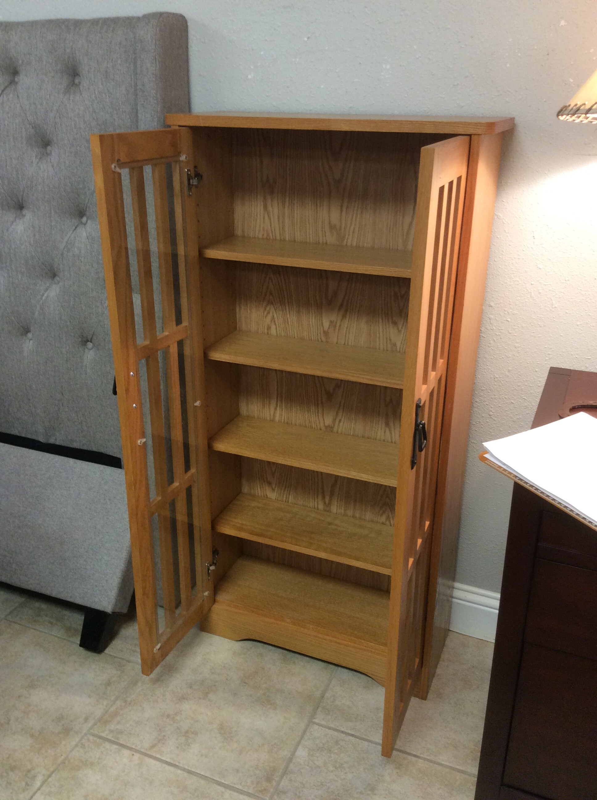 This is a beautiful Blonde Wood Stain Cabinet. This Cabinet has 5 adjustable shelfs and 2 glass doors.