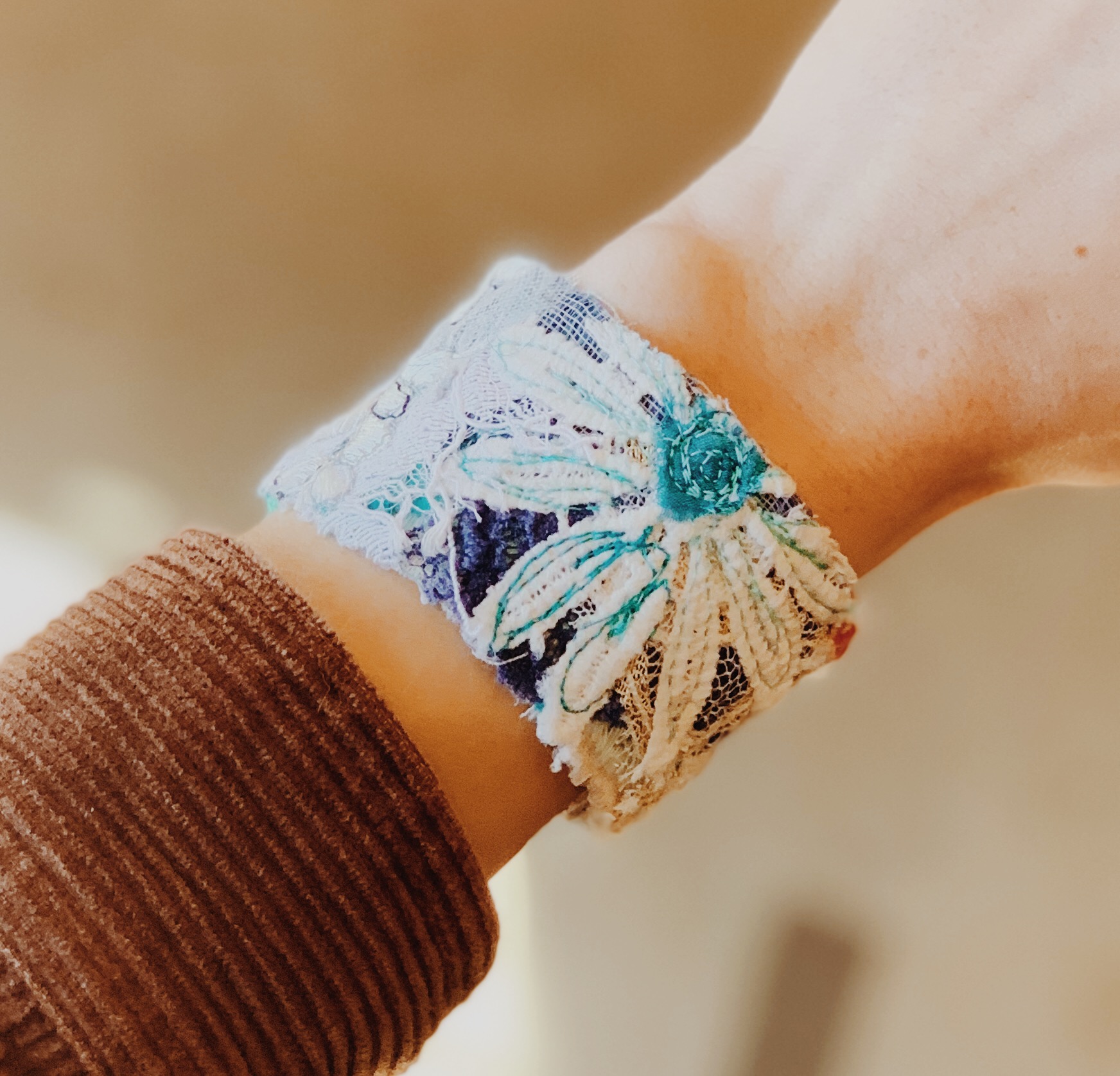 This gorgeous cuff by Kelli Hawk Designs is covered in hand done fabric layering! It measures 2.5 inches in diameter and about 1.5 inches tall.
