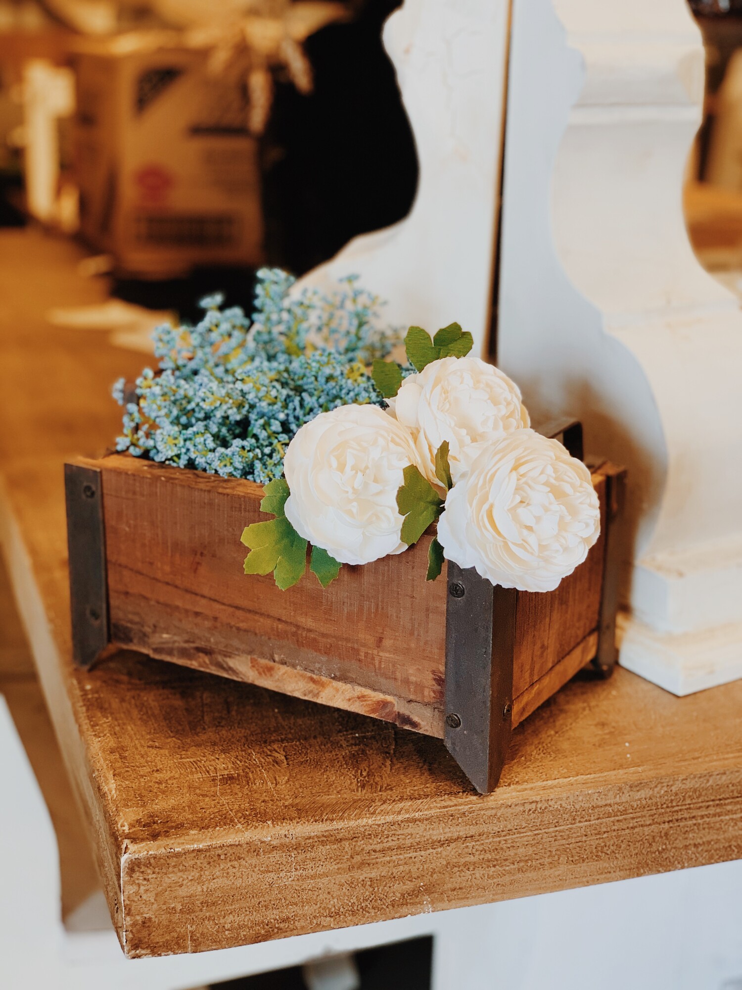 These wooden boxes are perfect paired with florals in any space! They measure 5 inches tall with 1.5 inch high metal handles, 10.5 inches wide, and 6.5 inches deep.