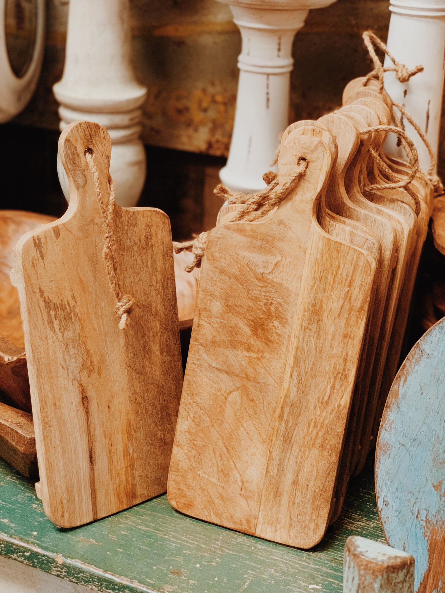These light wash, wood cutting boards have two legs that raise it off of the surface. It measures 14 inches long by 6 inches wide.