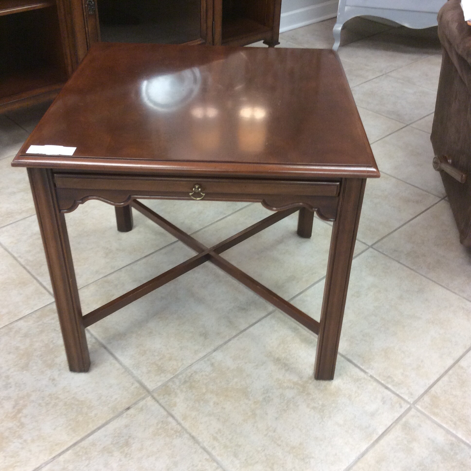 This traditional style Drexel end table has a cherry finish and Marlborough legs.