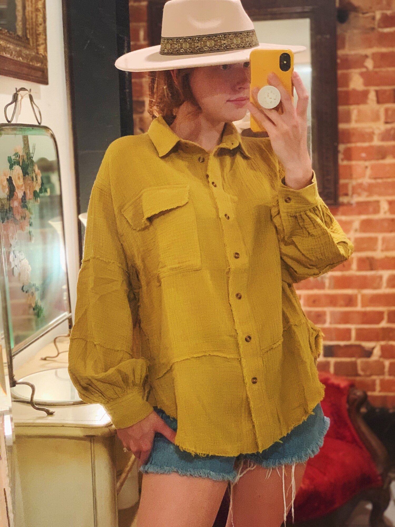 These gorgeous tops come in a rich mustard color and are made of the very popular gauze material with frayed hems! This is a staple piece!