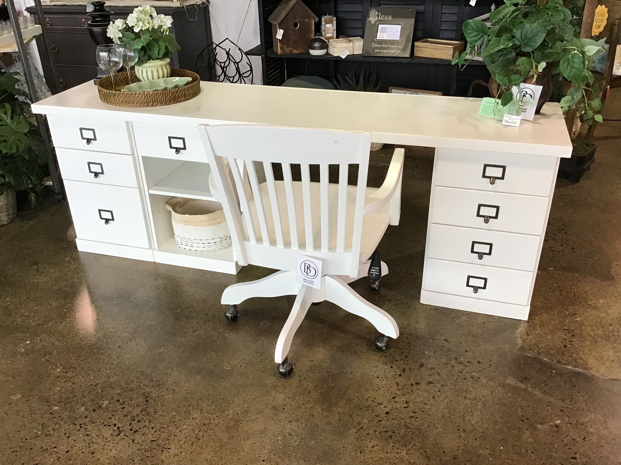This modular desk system from Ballard Designs comes from the Original Home Office collection. It comes with an 82 inch table top (not secured to the cabinets - it just sits on top of them), 3 cabinets and a desk chair. The cabinets are all different and set up as follows:
- 4 Small Drawers
- 1 Small Drawer & Open Cabinet with 1 Shelf
- 2 Small Drawers & 1 File Drawer
This set is currently sold on the Ballard Design website. The tabletop does have 2 imperfections on it.

Desk Dimensions - 82 in x 21 in x 28 in
Chair Dimensions - 22 in x 24 in x 34 in