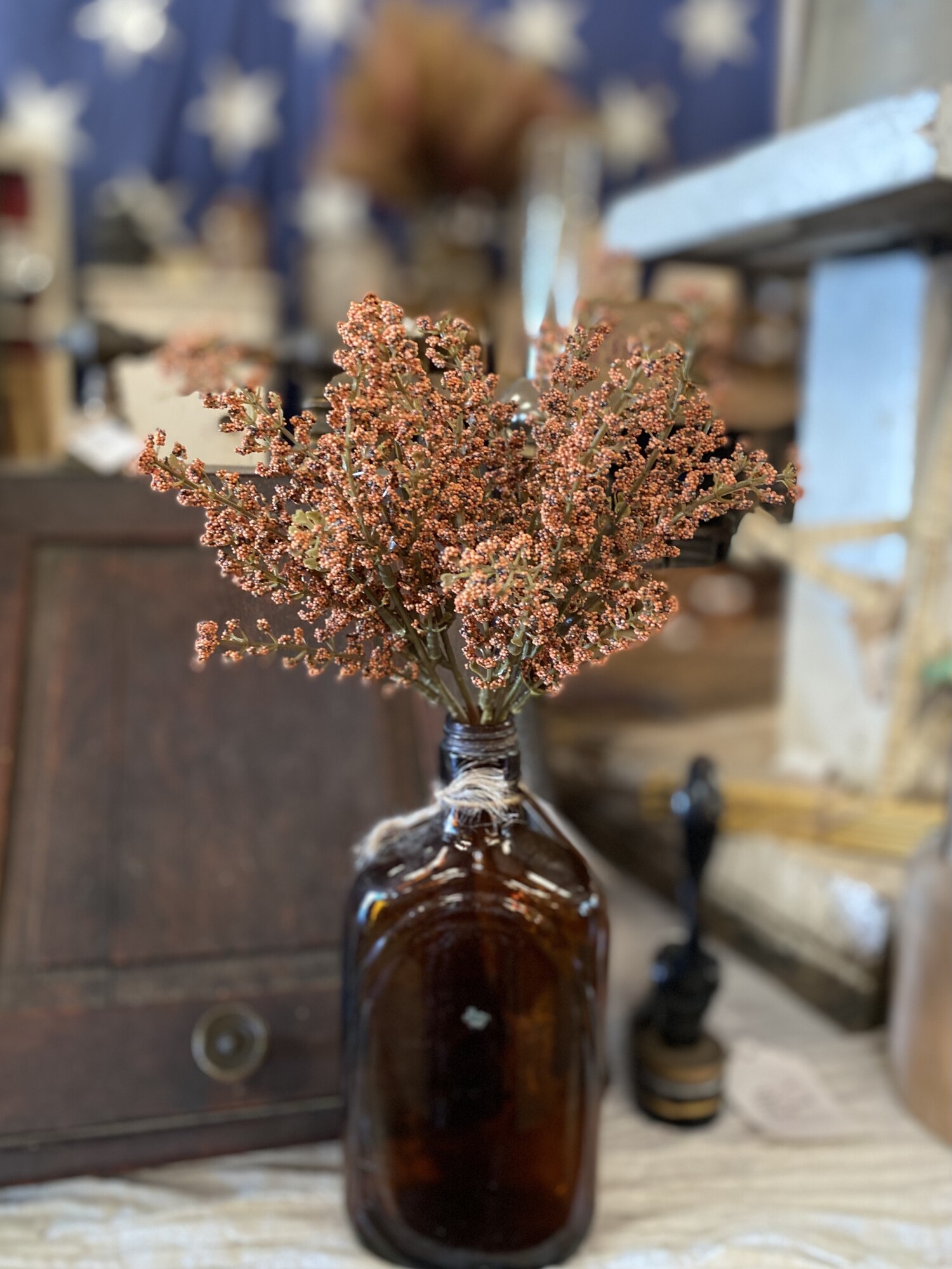 This pretty stem has pumpkin-colored astilbe buds on a green; plastic stem. It is a simple way to add a fall floral touch to any room and looks great in a jar; milk can or with decorative pumpkins. Pair with our pumpkin astilbe half sphere to create a festive fall display.  Stem measures 10.5 inches high by 6 inches wide
