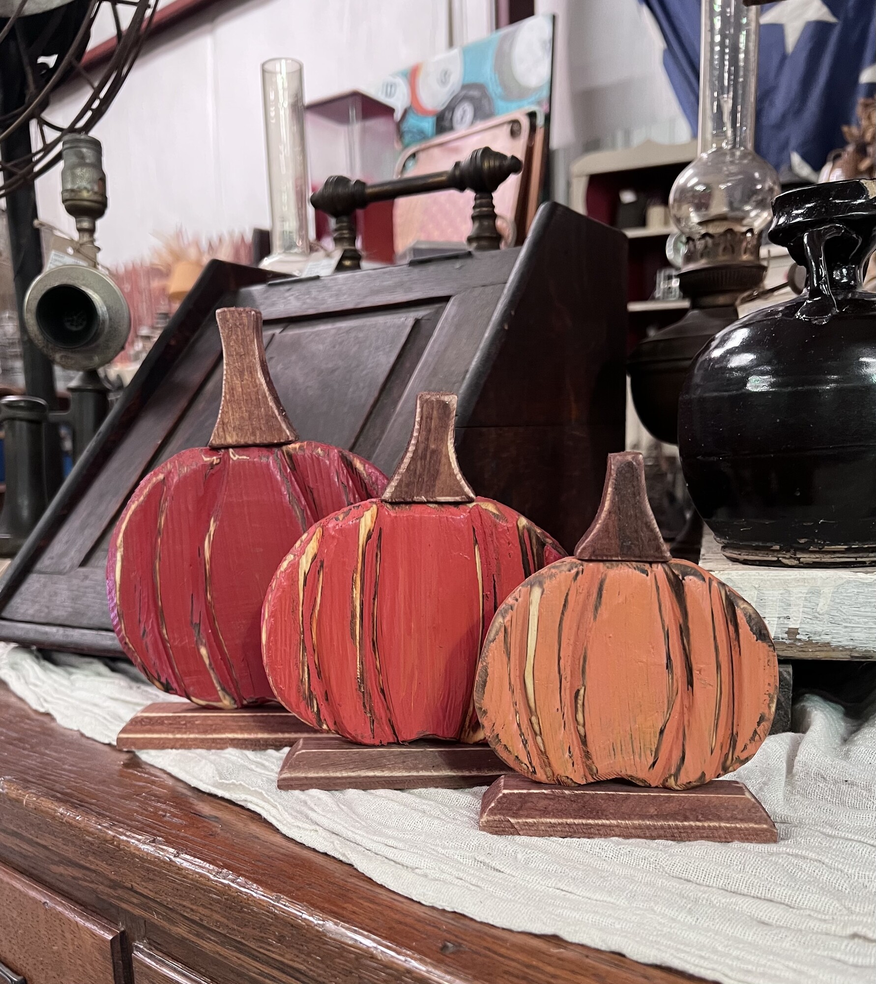 This adorable set of three pumpkins are made of wood and will add nice touch anywhere in your home this fall.
Small measures 5 and half inches tall and 4 inches wide.
Medium measures 6 and a half by 6 inches tall
Large measures 8 inches tall and 6 and half inches wide