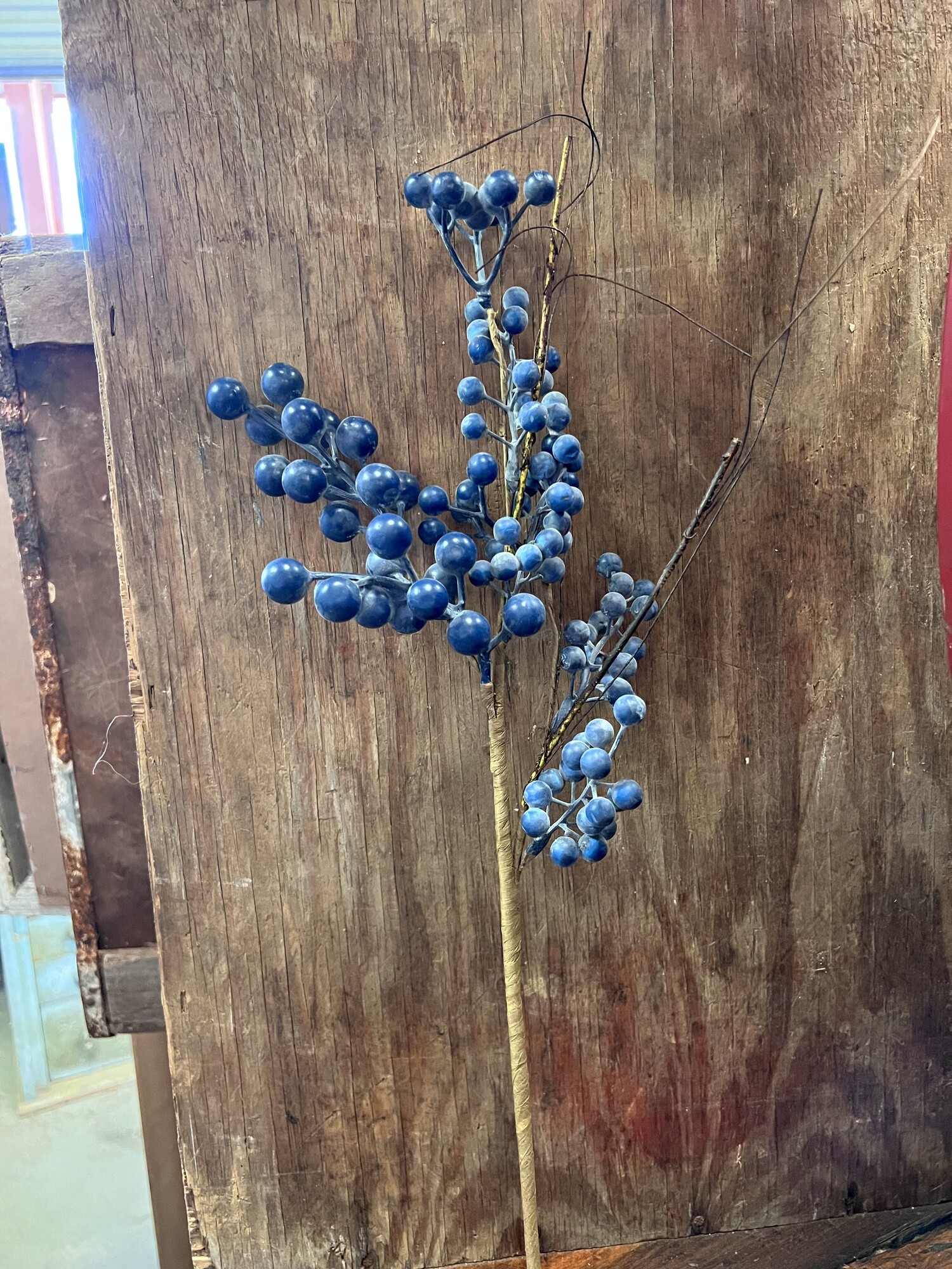 Gorgeous Blueberry stem that looks like real blueberries. This stem is beautiful on its own or pair it with any floral arraingment.  Would be pretty tucked into a flocked Chrstmas tree or paired with lemon stems.
Stem is 22 inches in length with a few twigs for that perfect look. Stem is wrapped in brown floral paper